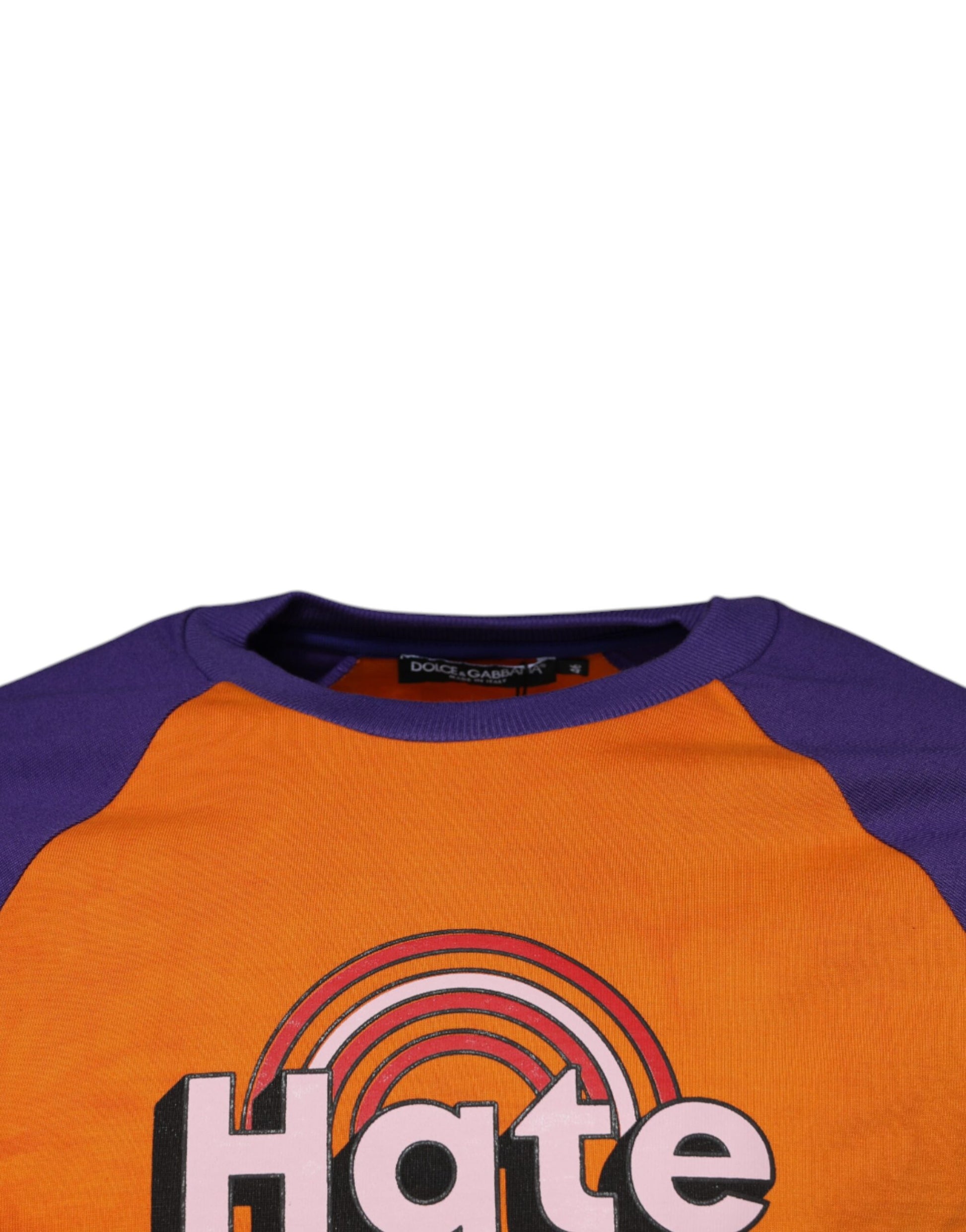 Orange long sleeve shirt with "HATE" written on front in white letters