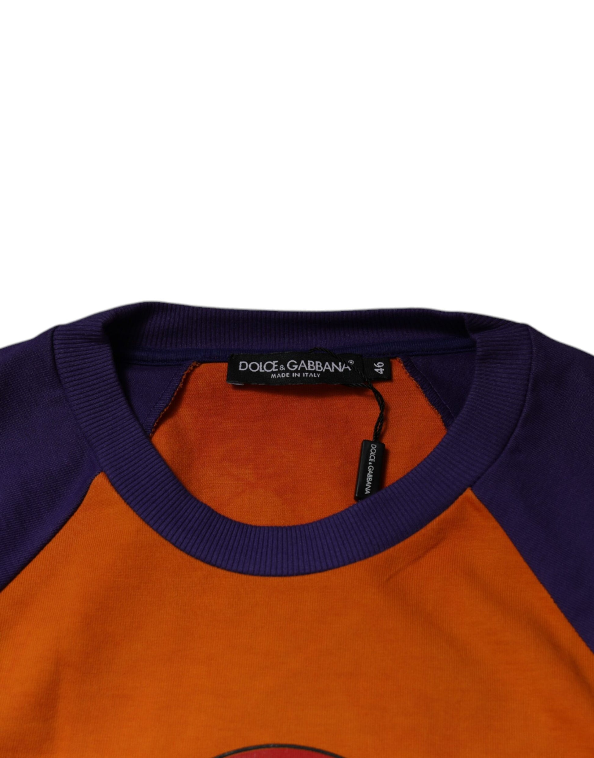 Purple and orange baby onesie on hanger