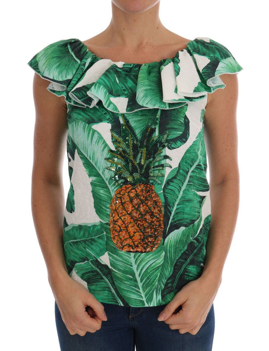 Woman wearing a top with pineapple and palm leaves pattern