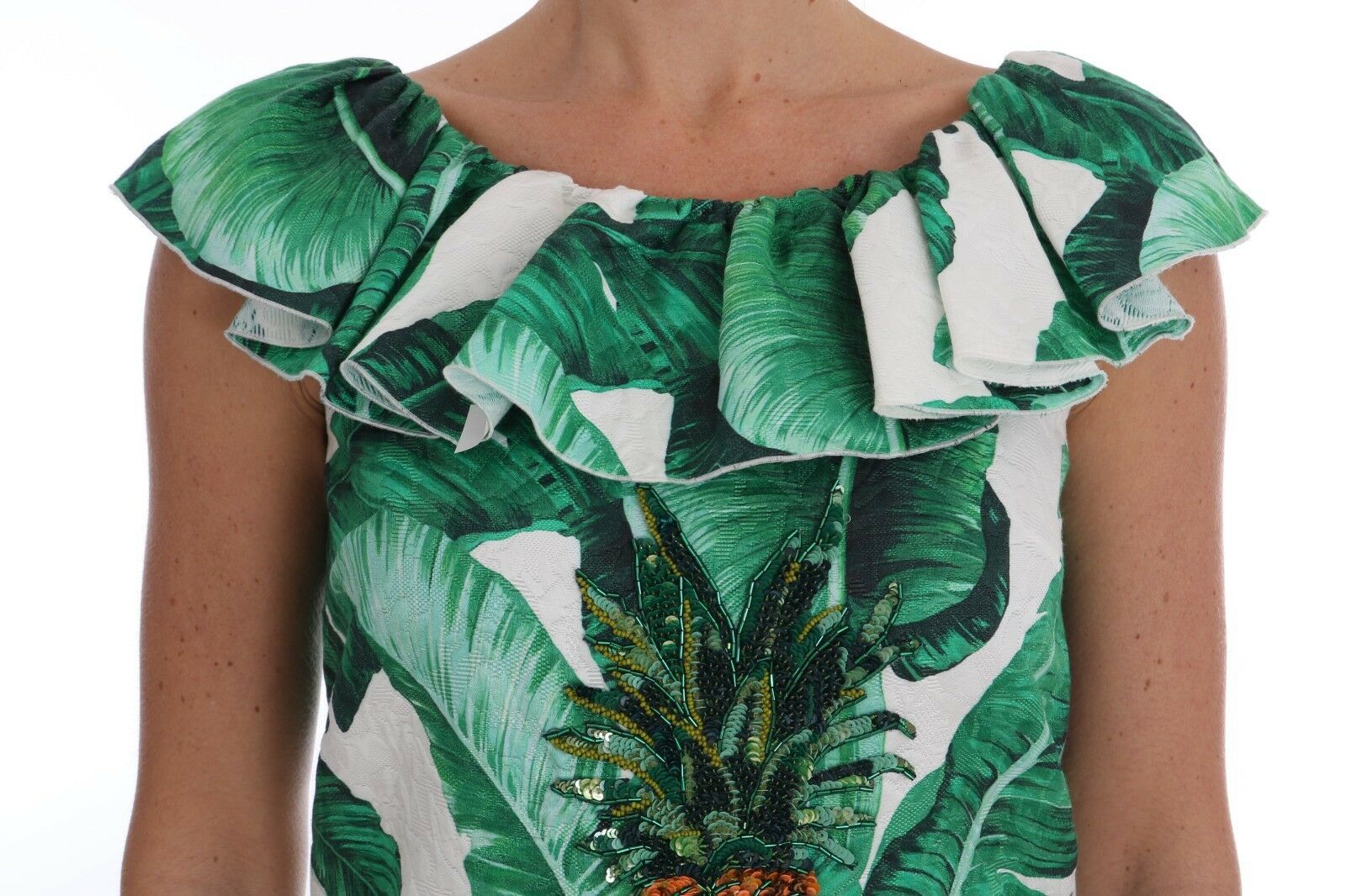 Green and white floral print dress with ruffles on shoulders