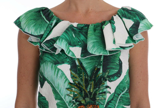 Green and white floral print dress with ruffles on shoulders