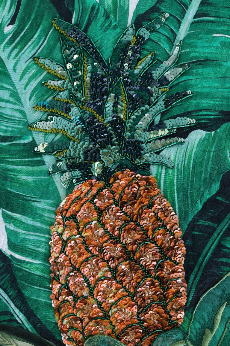Pineapple on a green leafy plant