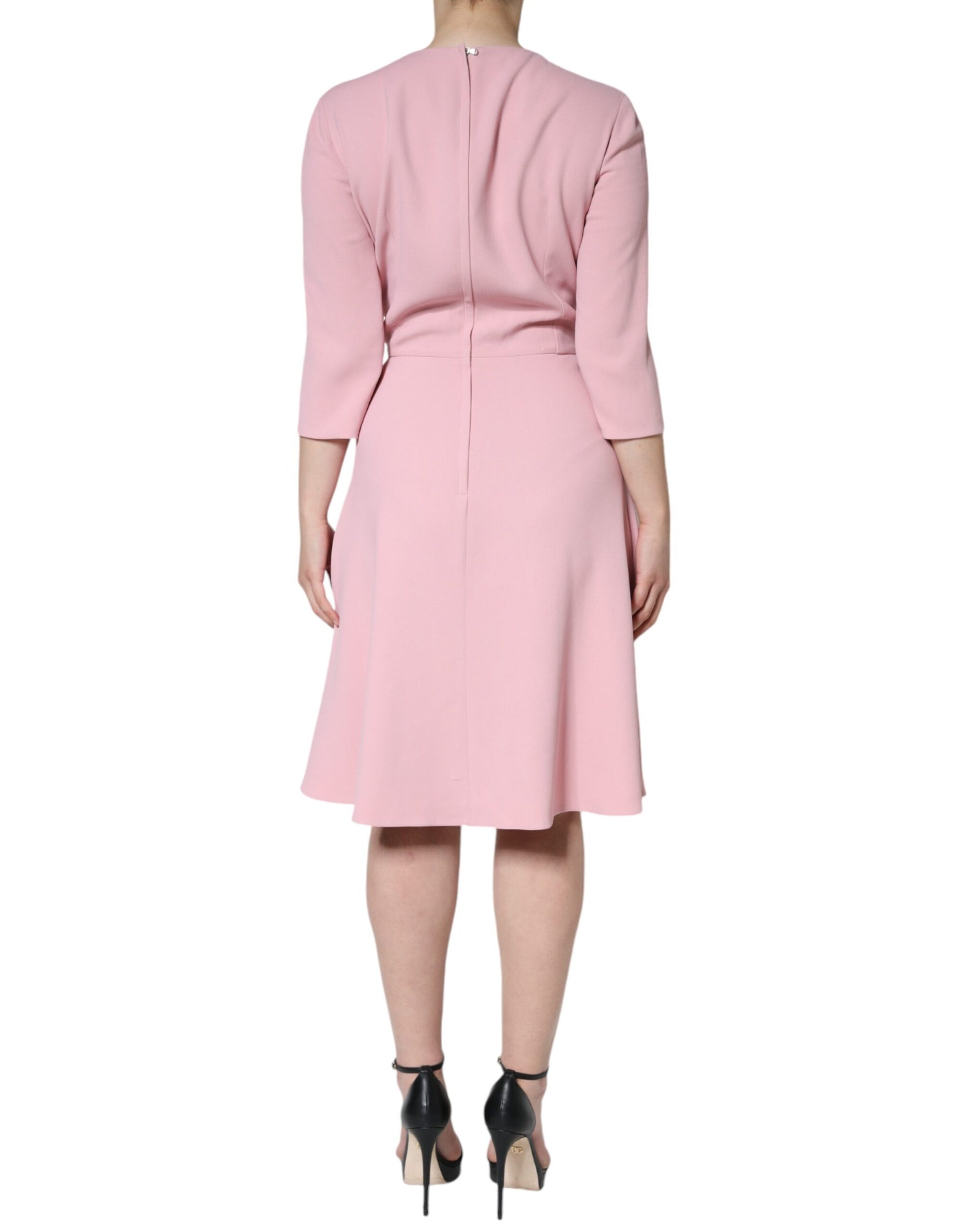 Pink dress with 3/4 sleeves and a flared skirt