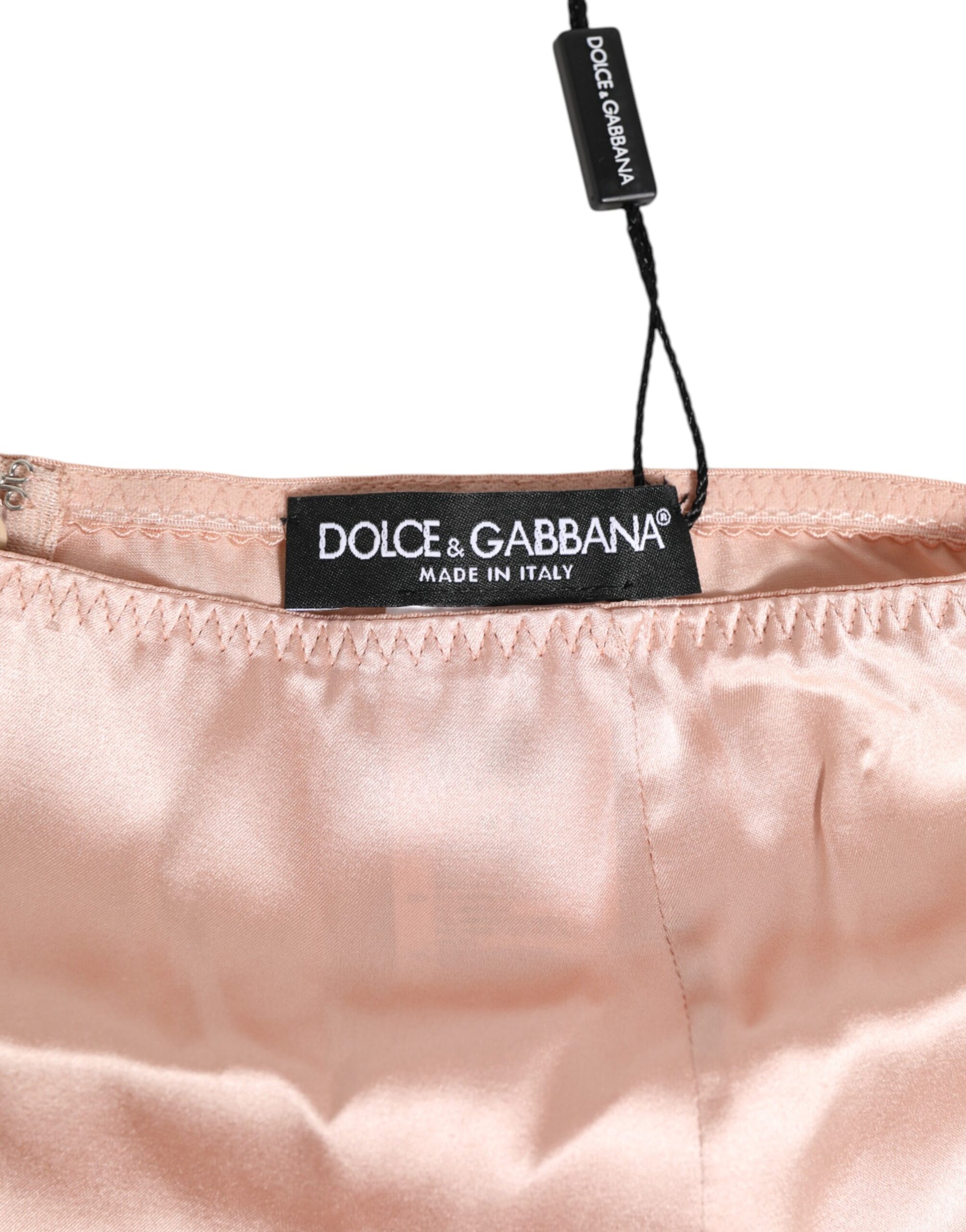 A pair of pink acetate high waist shorts from Dolce & Gabbana