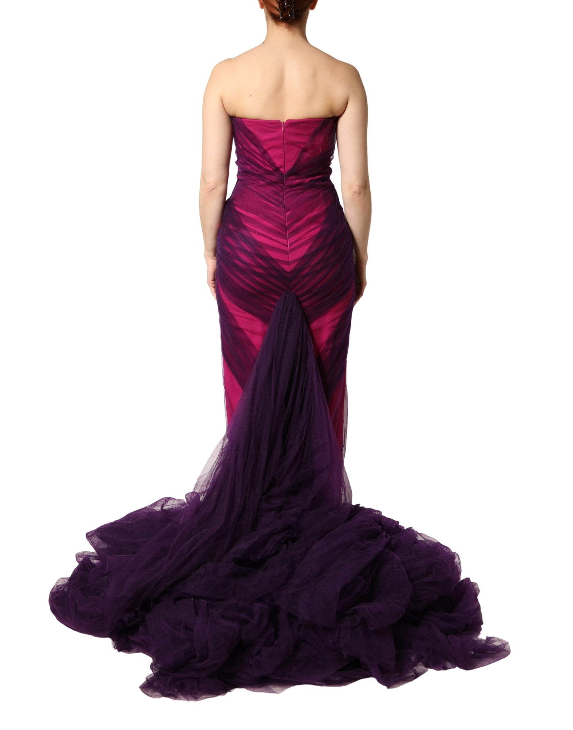 A pink and black strapless sheath mermaid dress with ruffled detailing