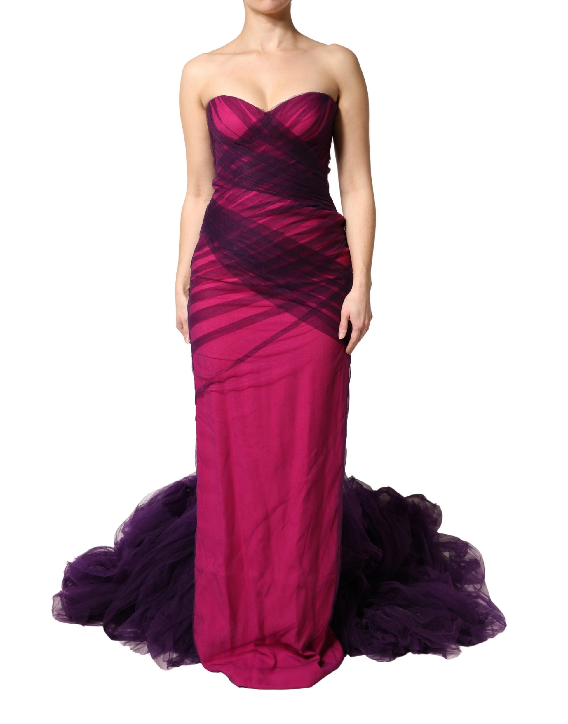 A pink and black strapless mermaid dress with a sheer skirt