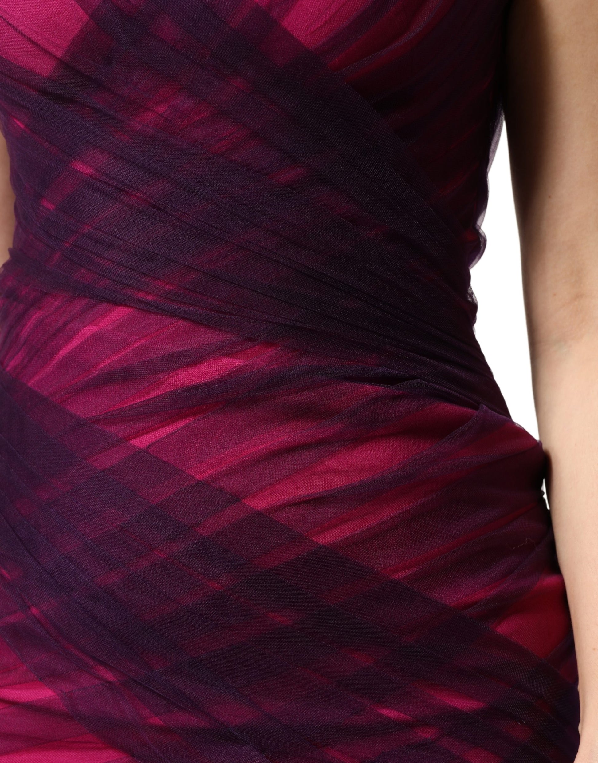 A strapless sheath mermaid dress in pink and black with a ruched texture