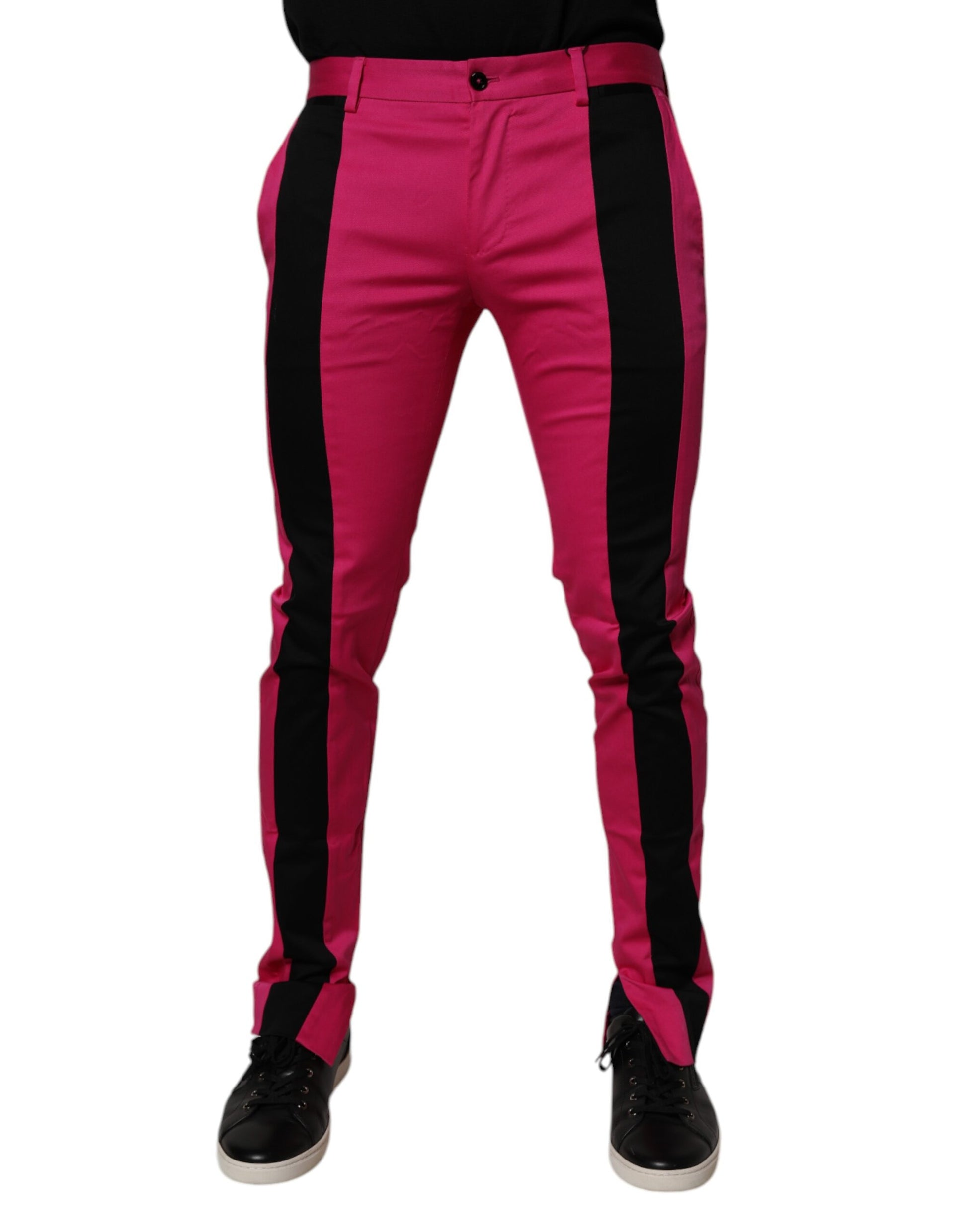 A pair of men's pants with a slim fit. They feature a black and pink striped pattern on the legs, which is ch
