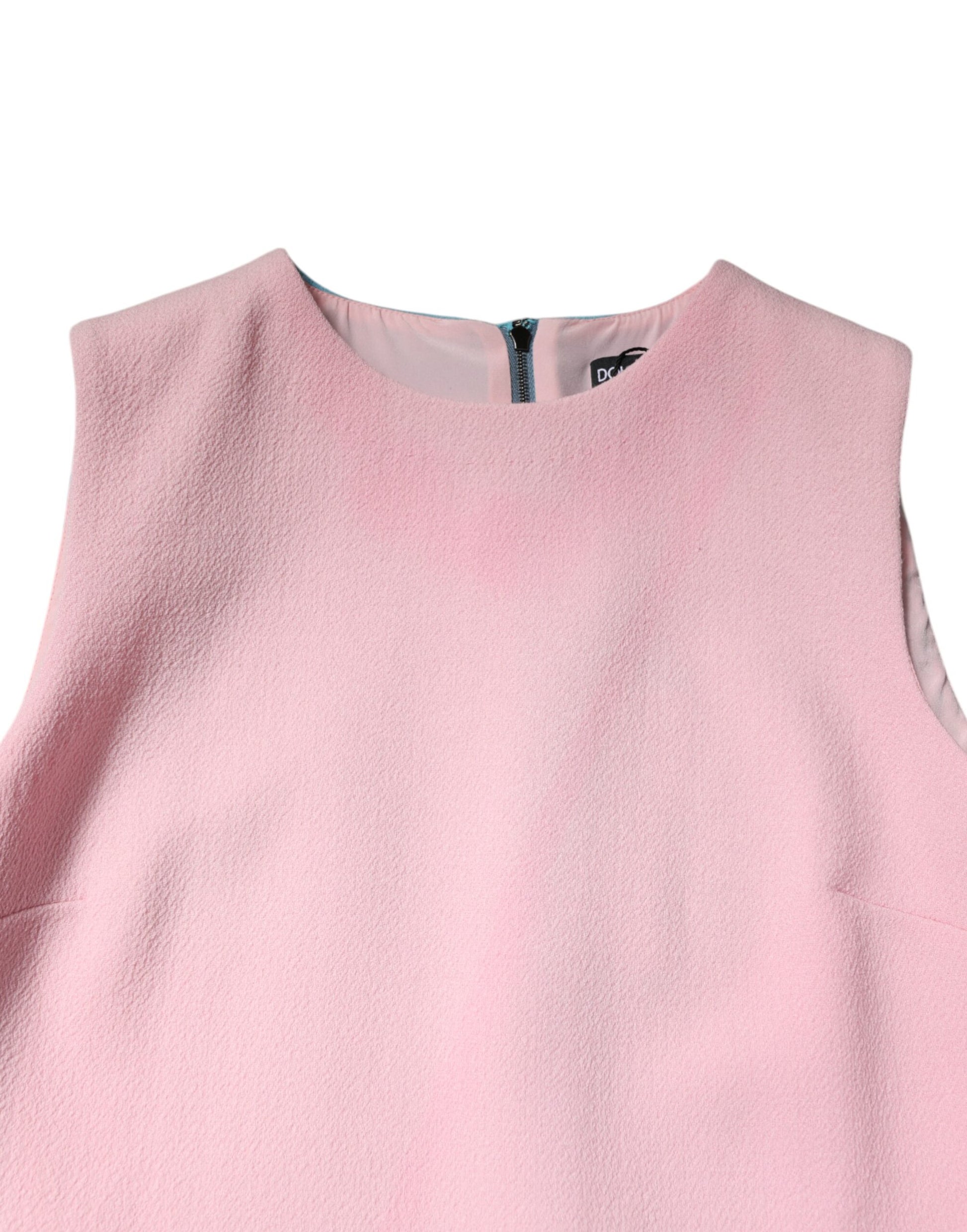 A sleeveless pink dress with a blue wool texture