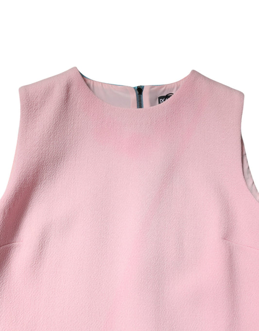 A sleeveless pink dress with a blue wool texture