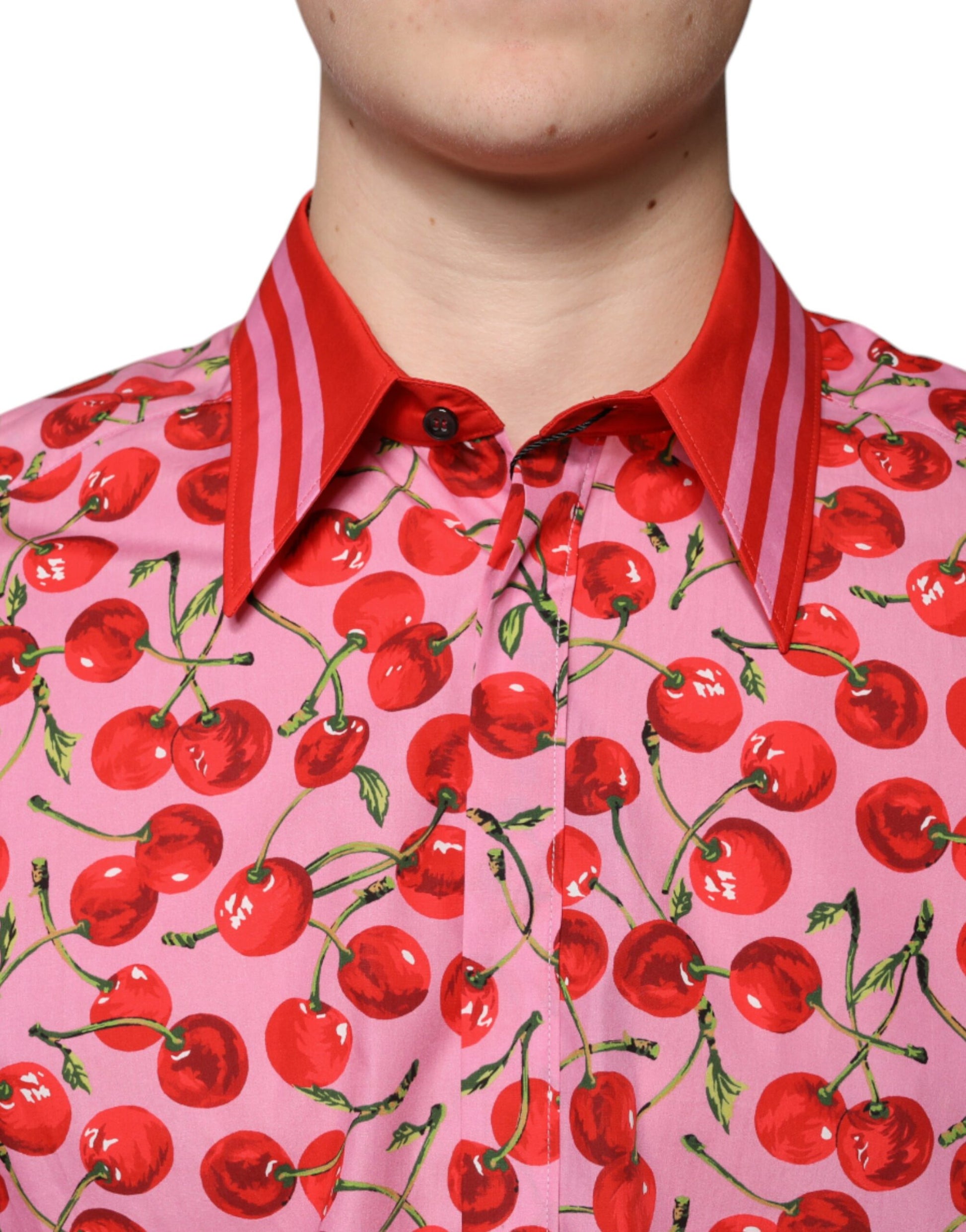 A pink shirt with cherries on it, part of the Dolce & Gabbana collection