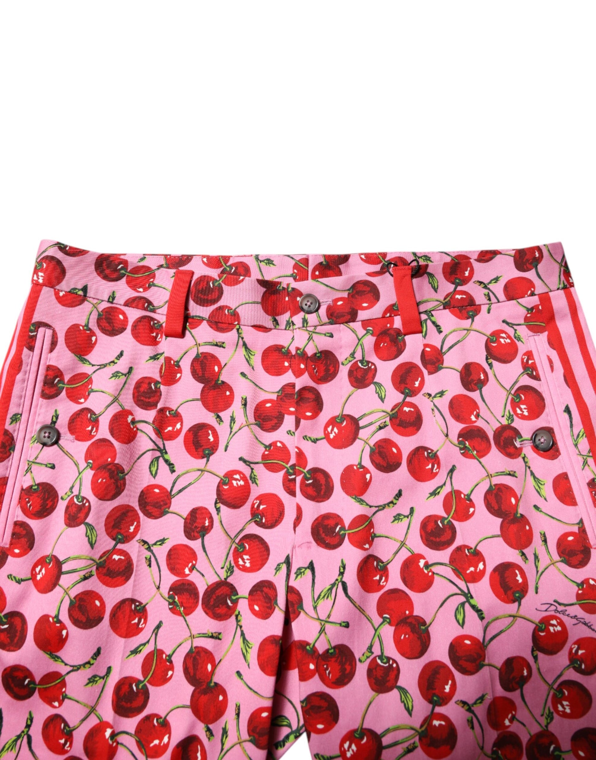 Pair of pink cherry print cotton dress pants by Dolce & Gabbana