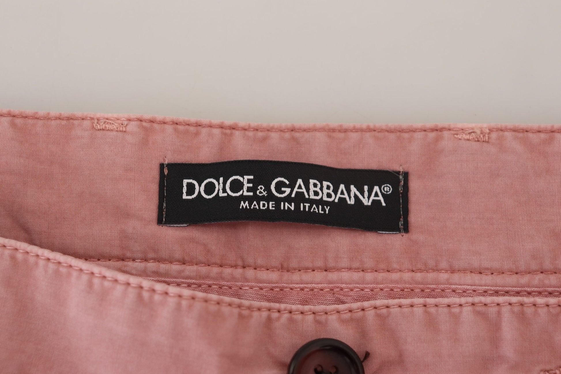 Pink pants with black label