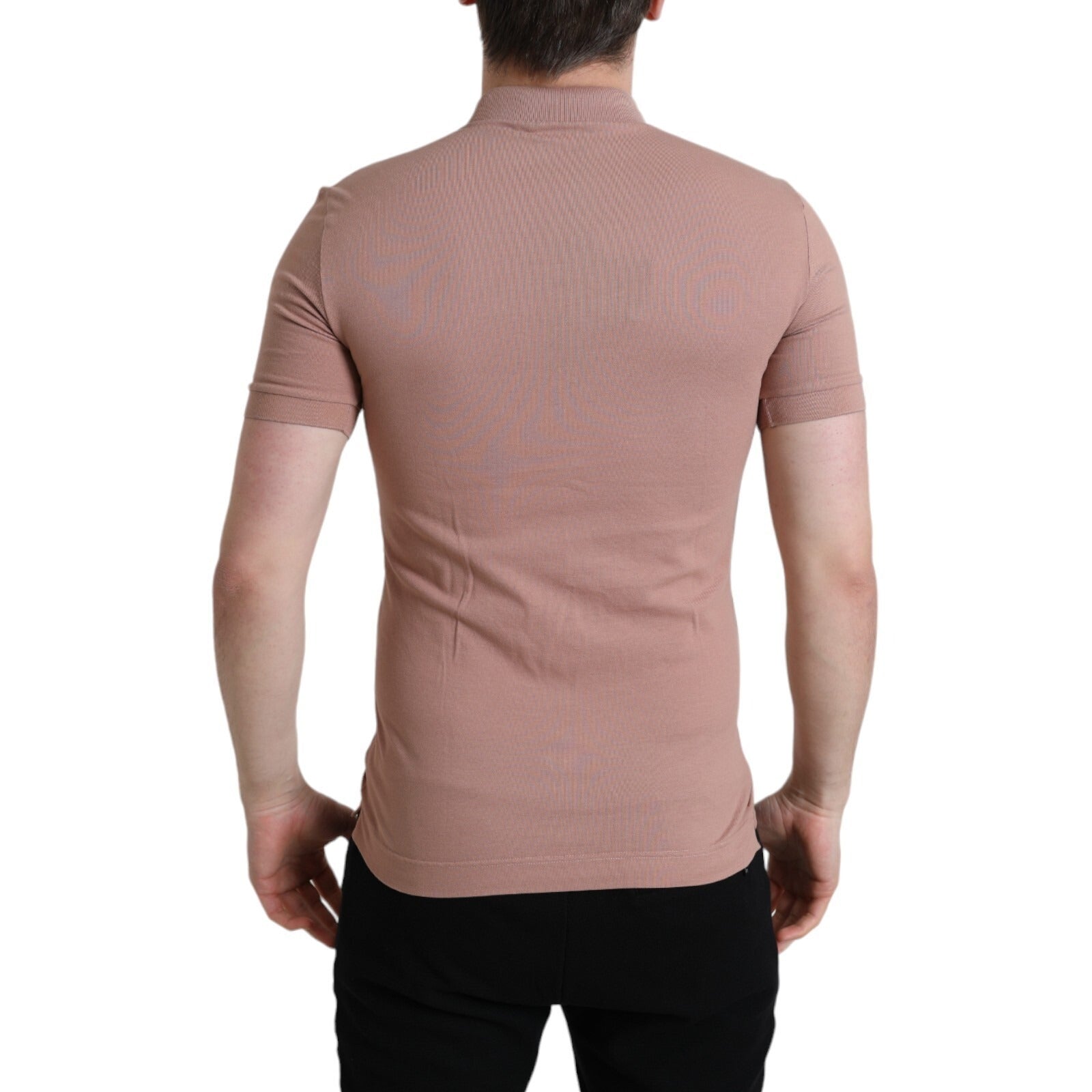 Man wearing a pink turtleneck sweater