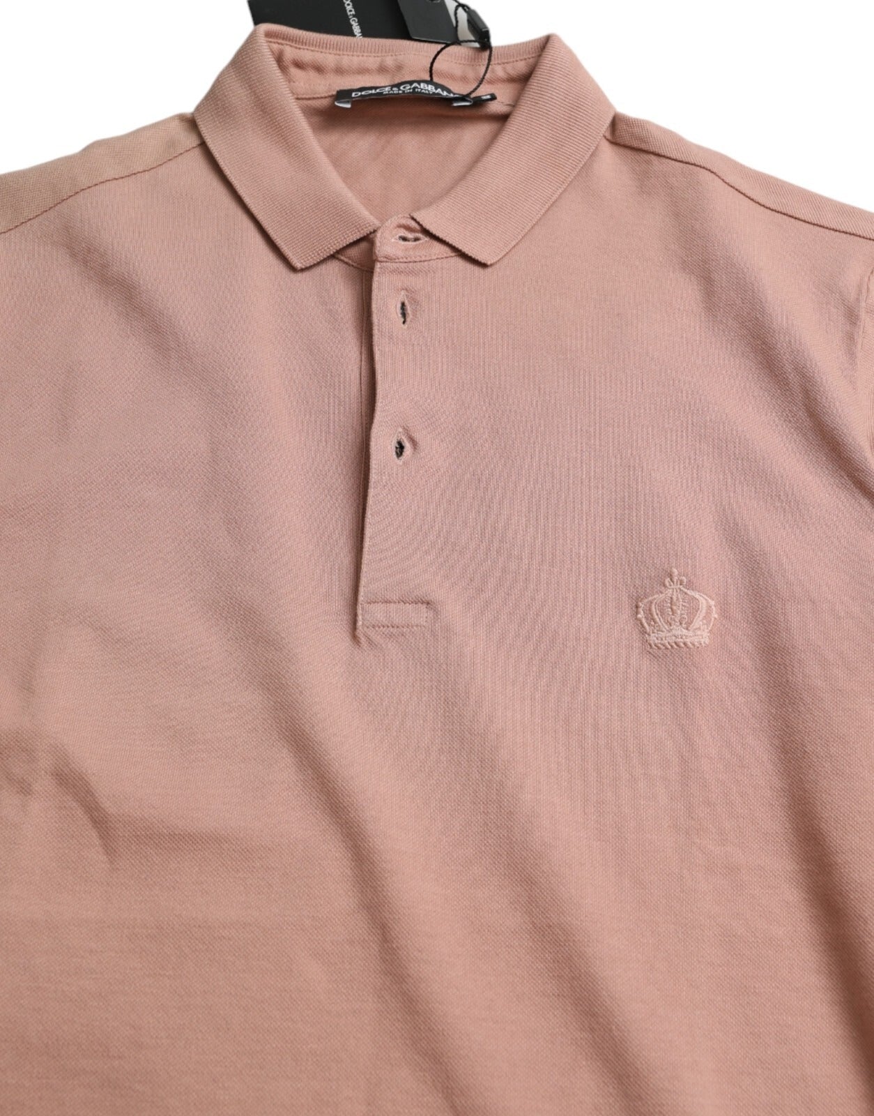 Pink polo shirt on hanger