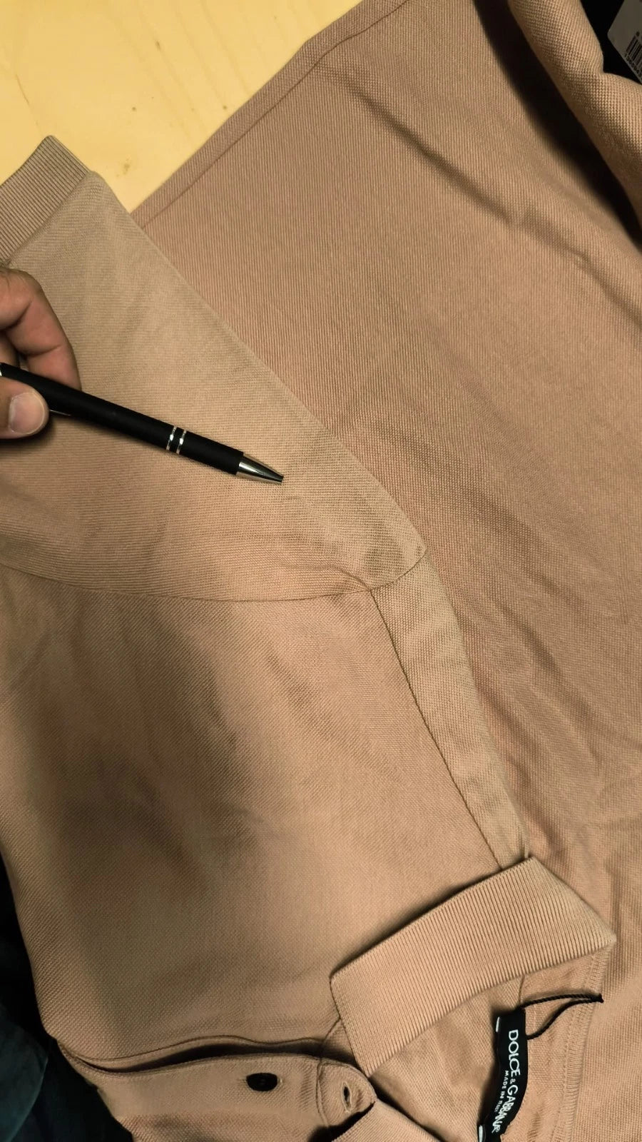 Brown corduroy jacket with black pen on top