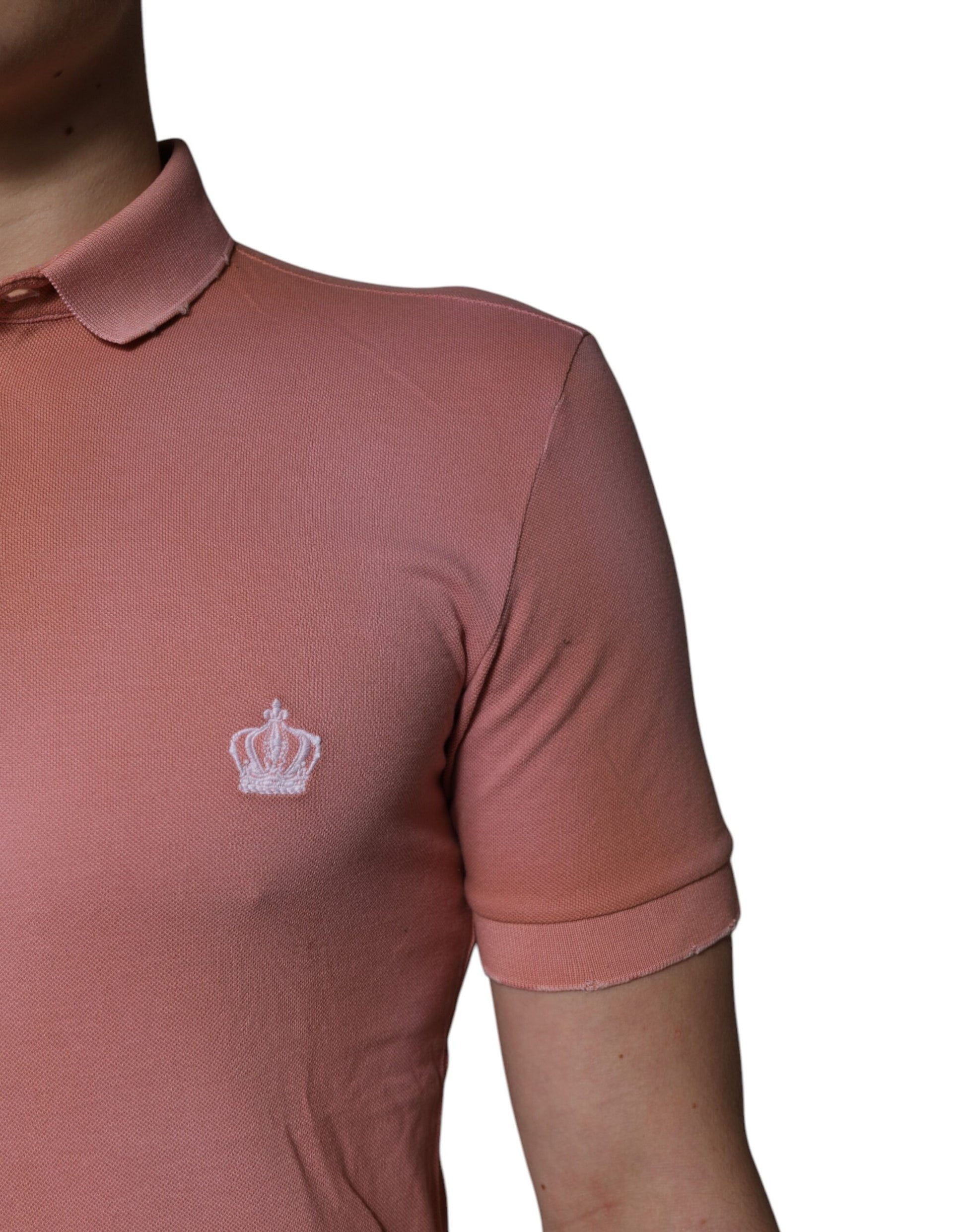 Pink polo shirt with embroidered crown logo on left chest