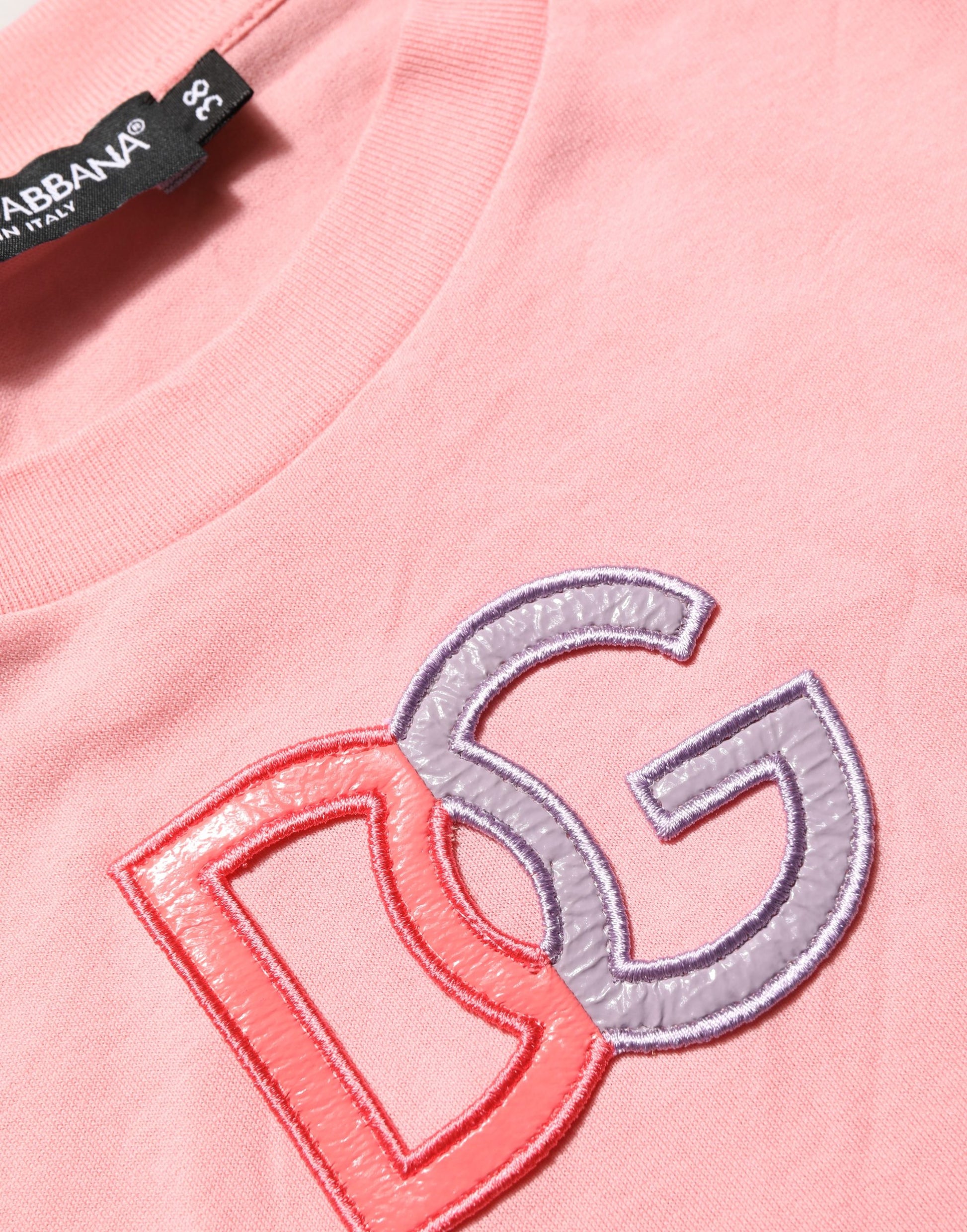 A pink cotton tank top with a round neck and the Dolce & Gabbana logo embroidered on it