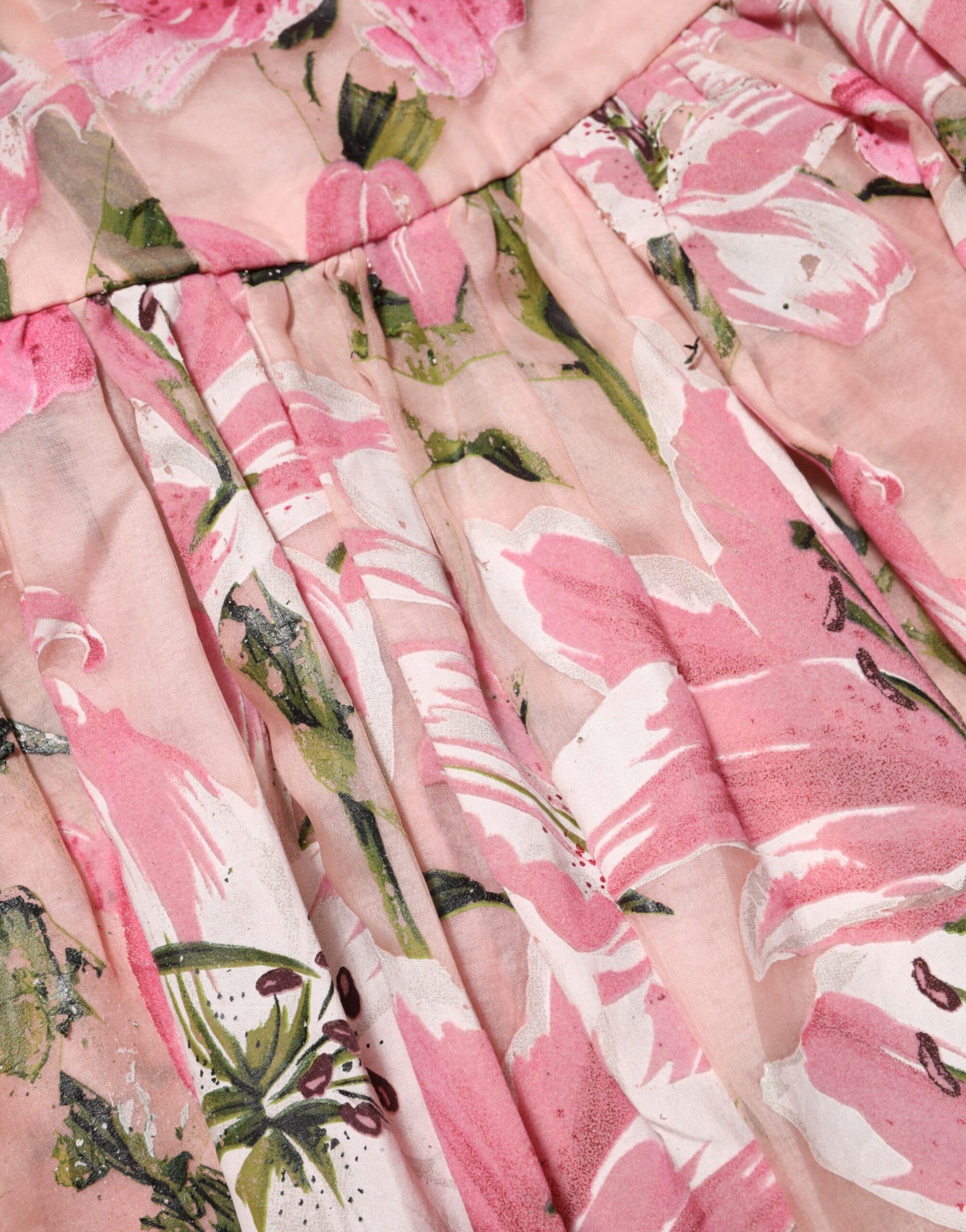 A pink floral pleated dress with short sleeves