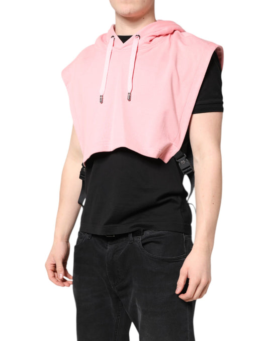 Man wearing black shirt and pink vest
