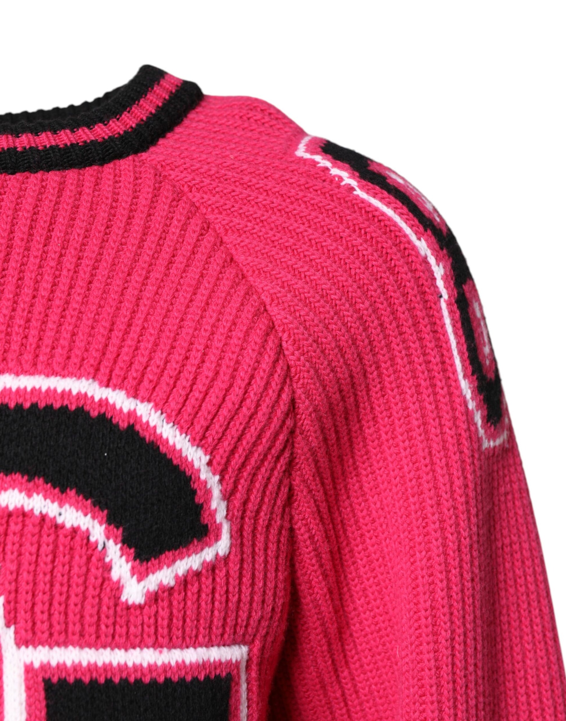 Pink knit sweater with lettering on back