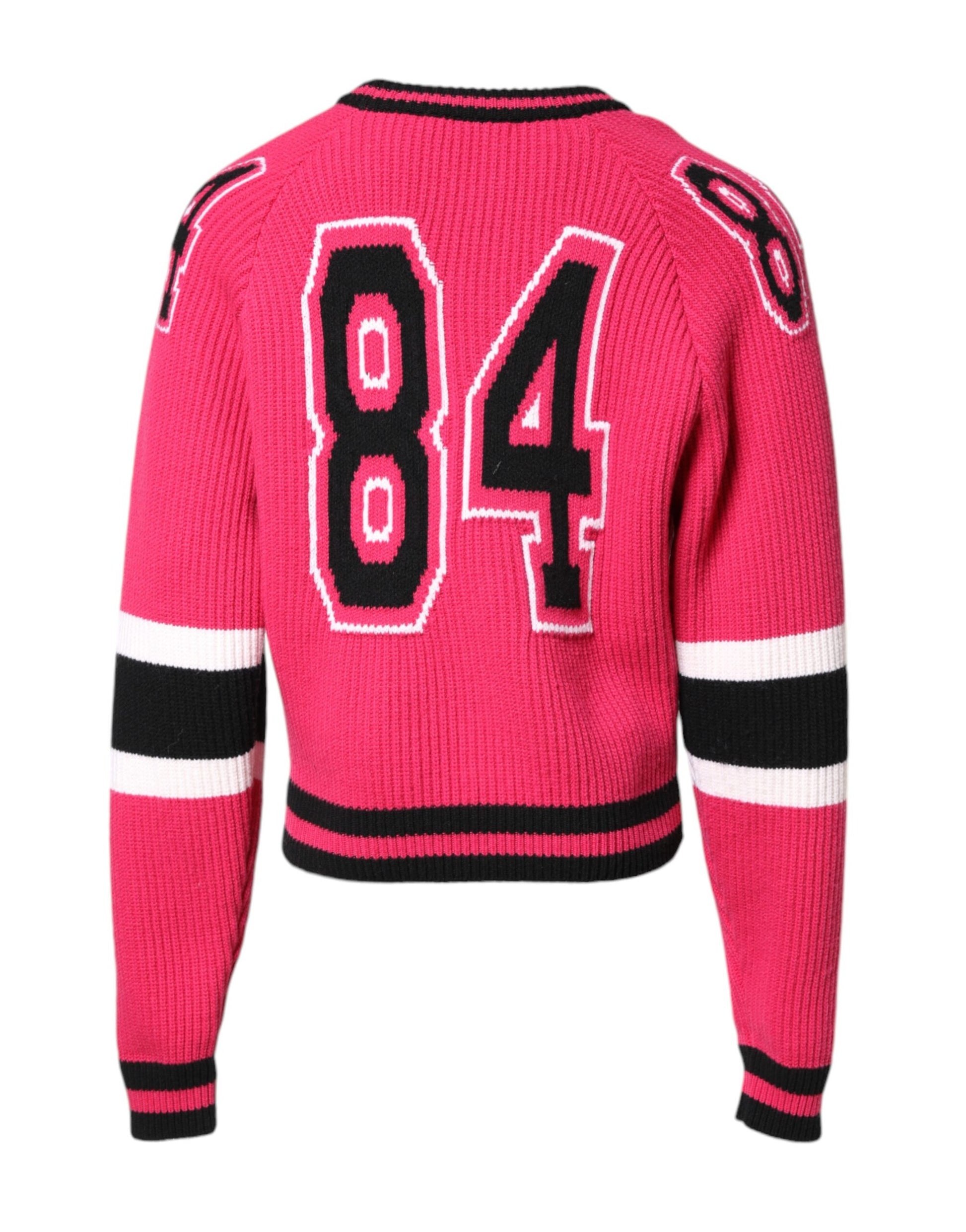 Pink sweater with red lettering and black trim