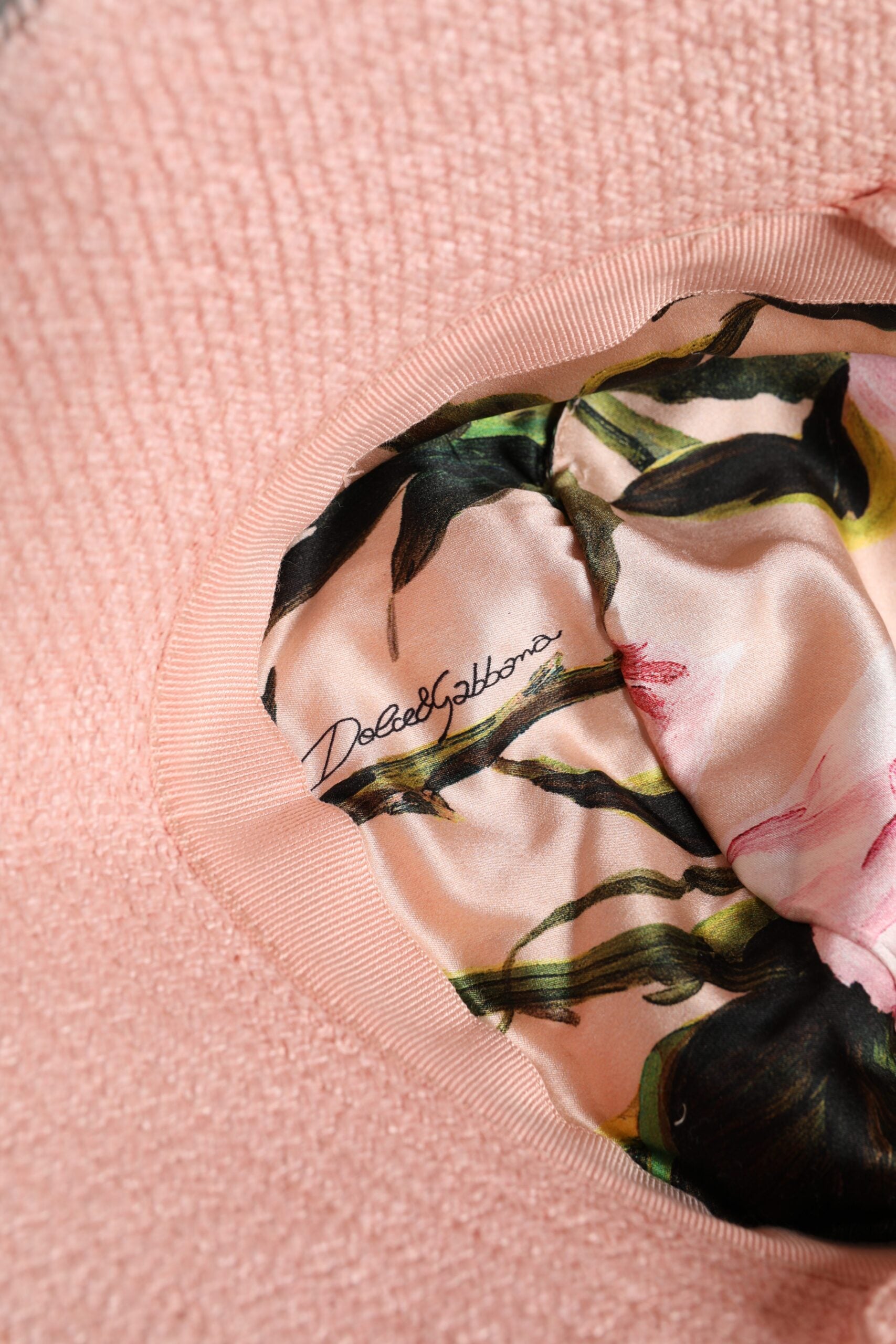 Pink jacket with floral pattern on sleeve