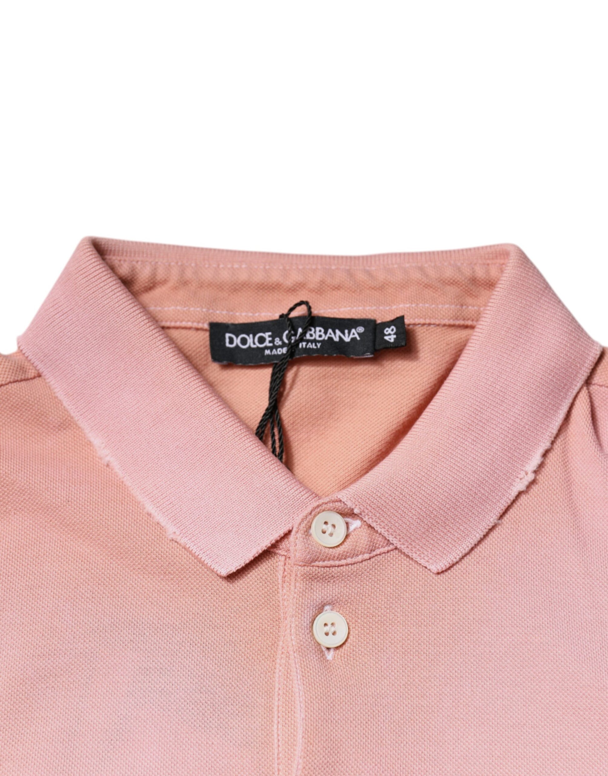 Pink polo shirt on hanger