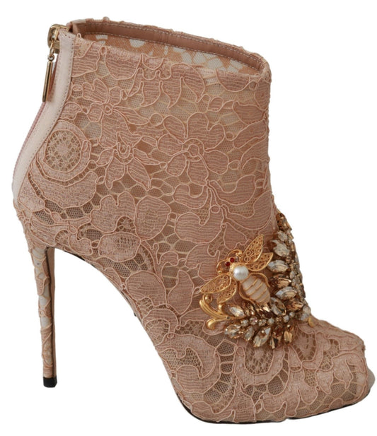 Pair of high heel shoes with embellishments and lace design