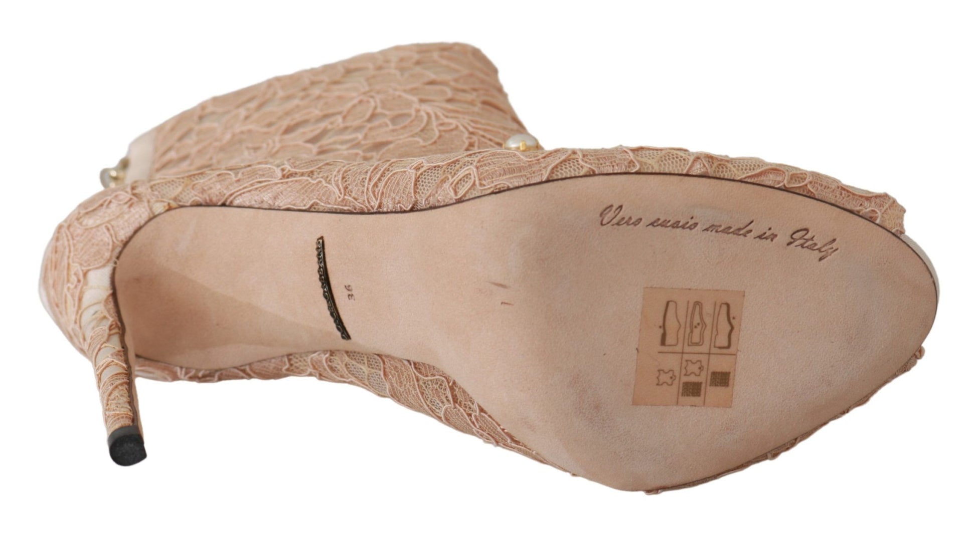 Pair of women's shoes with embroidered design and tag on insole