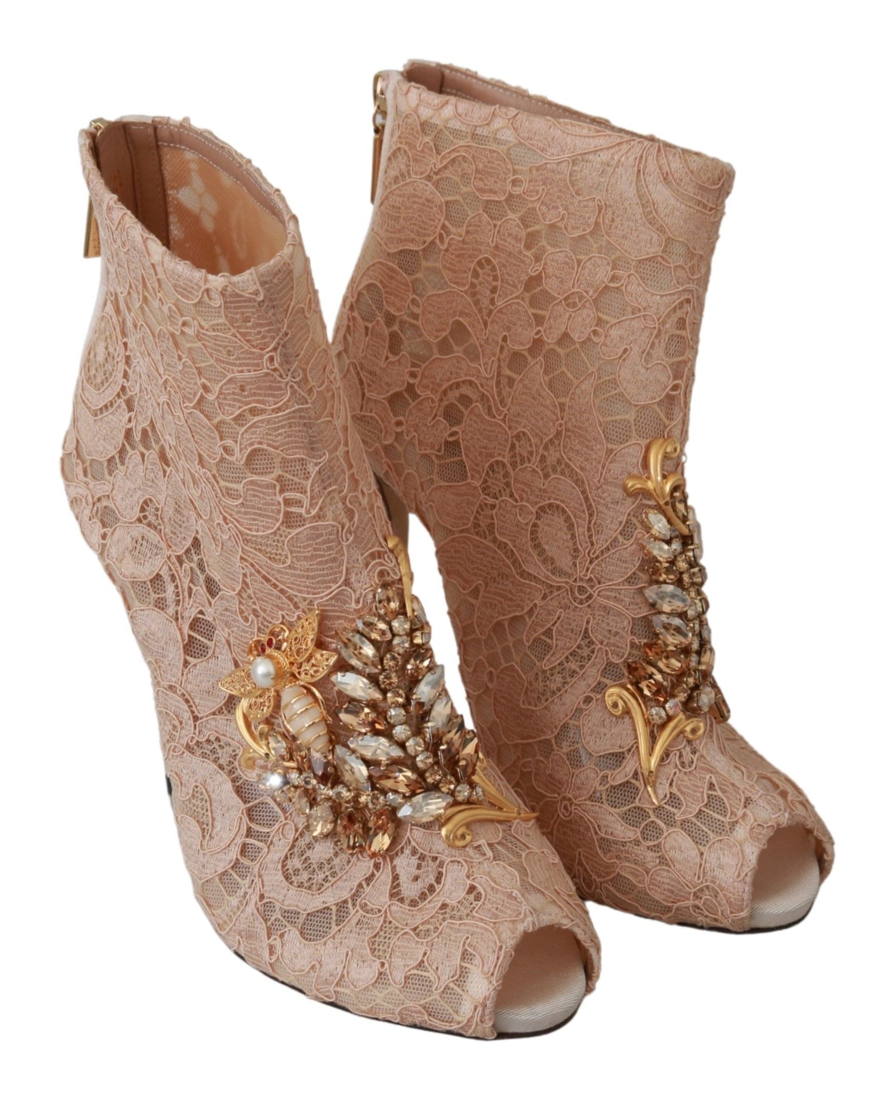 Pair of women's high heel boots with embellishments and lace design