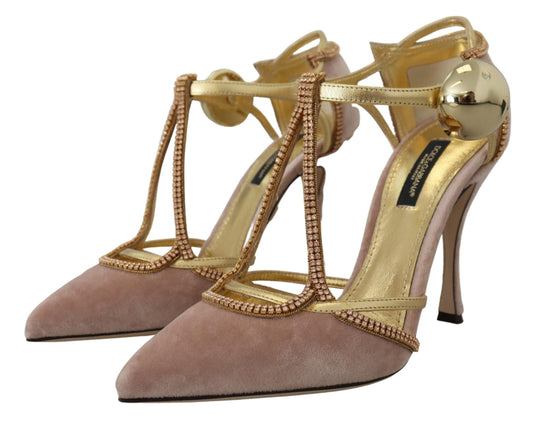 Pair of gold and pink high heel shoes with embellishments on straps