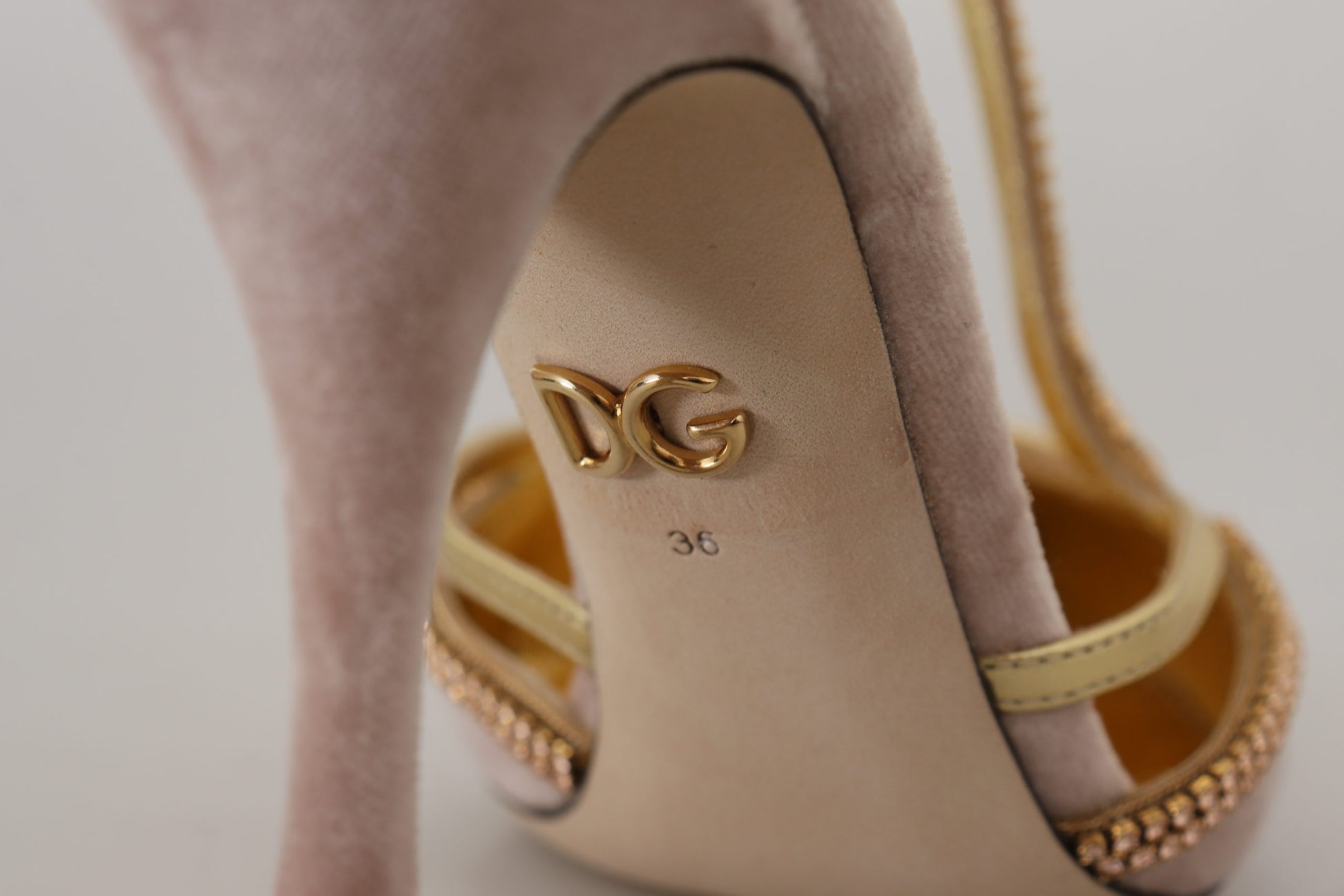 High heel shoe with gold buckle and embellishments