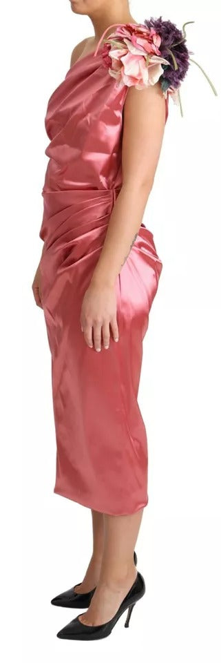 A pink midi dress with floral applique detailing