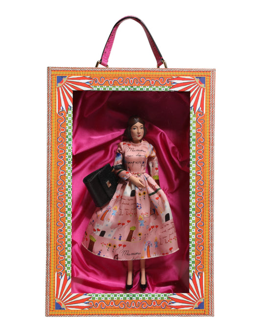 A porcelain doll wearing a pink dress with floral pattern, designed by Dolce & Gabbana