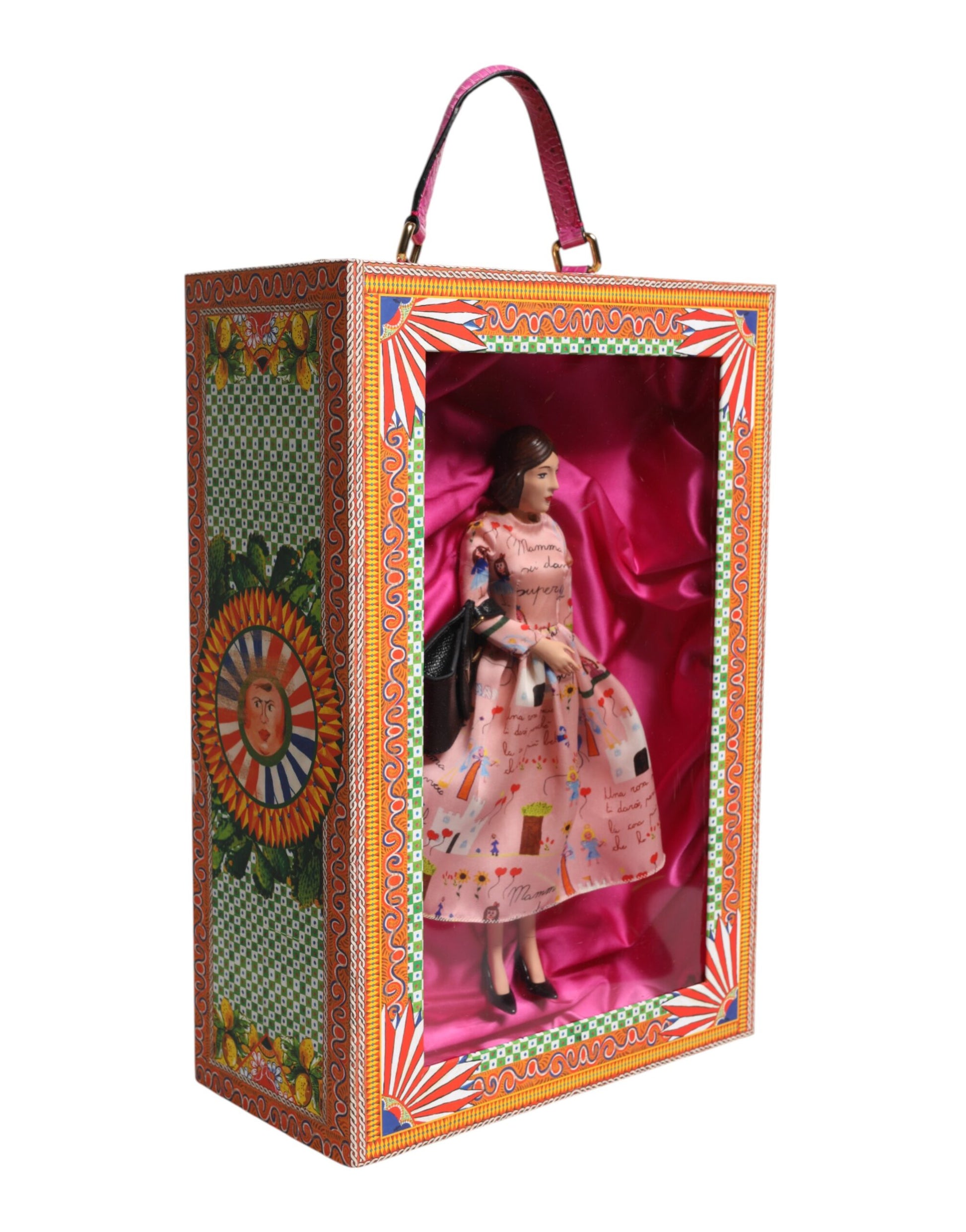 A porcelain doll wearing a pink dress with floral patterns