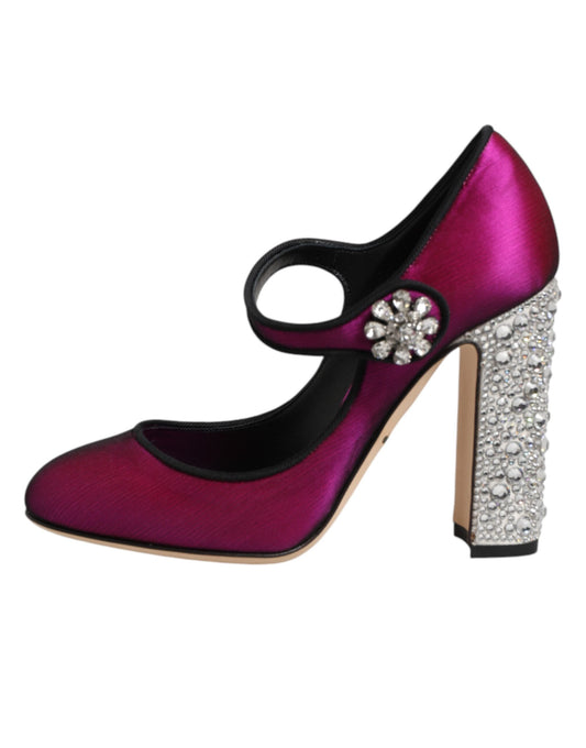 Pair of pink high heel shoes with rhinestones on toe