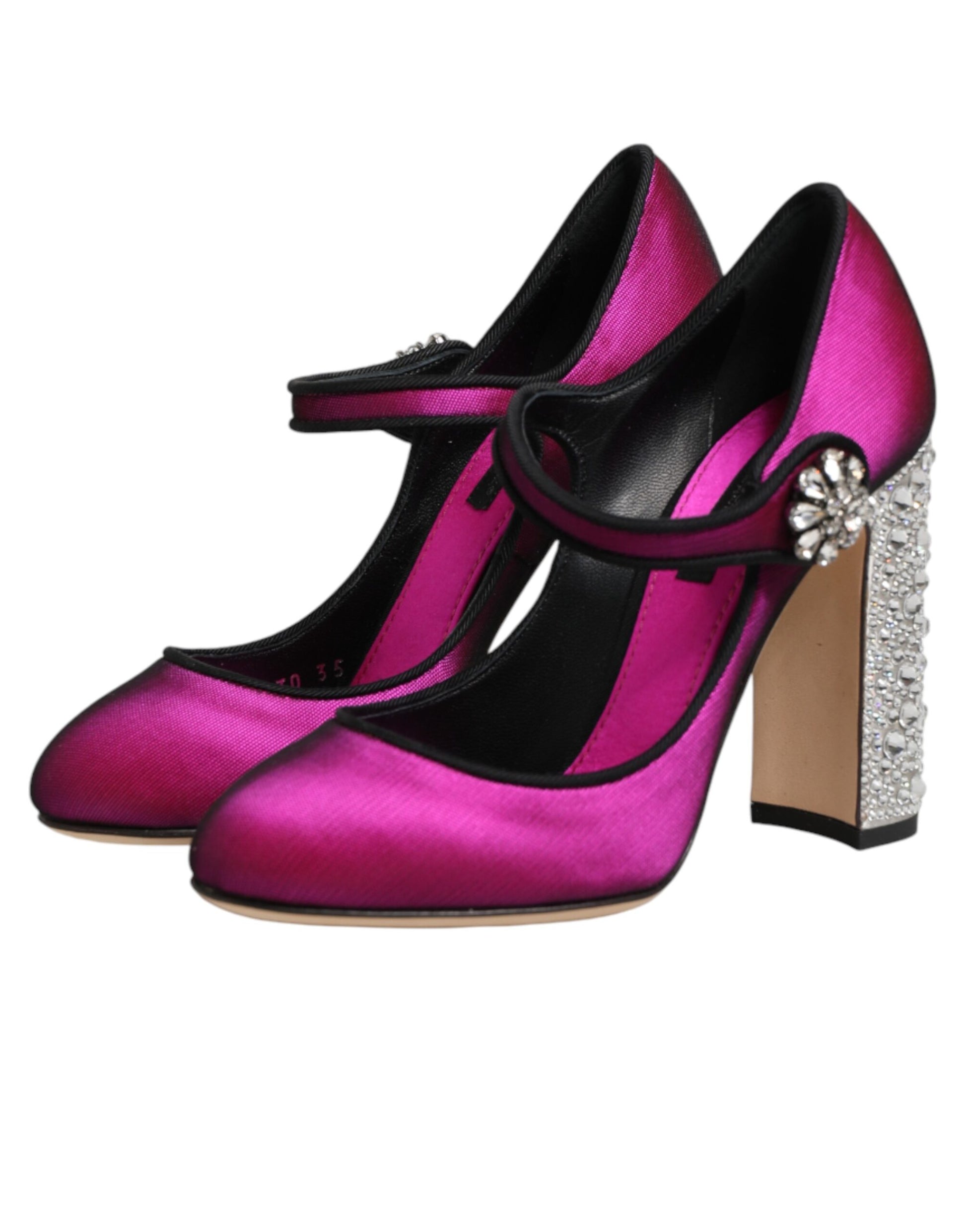 Pair of pink shoes with black laces and heels