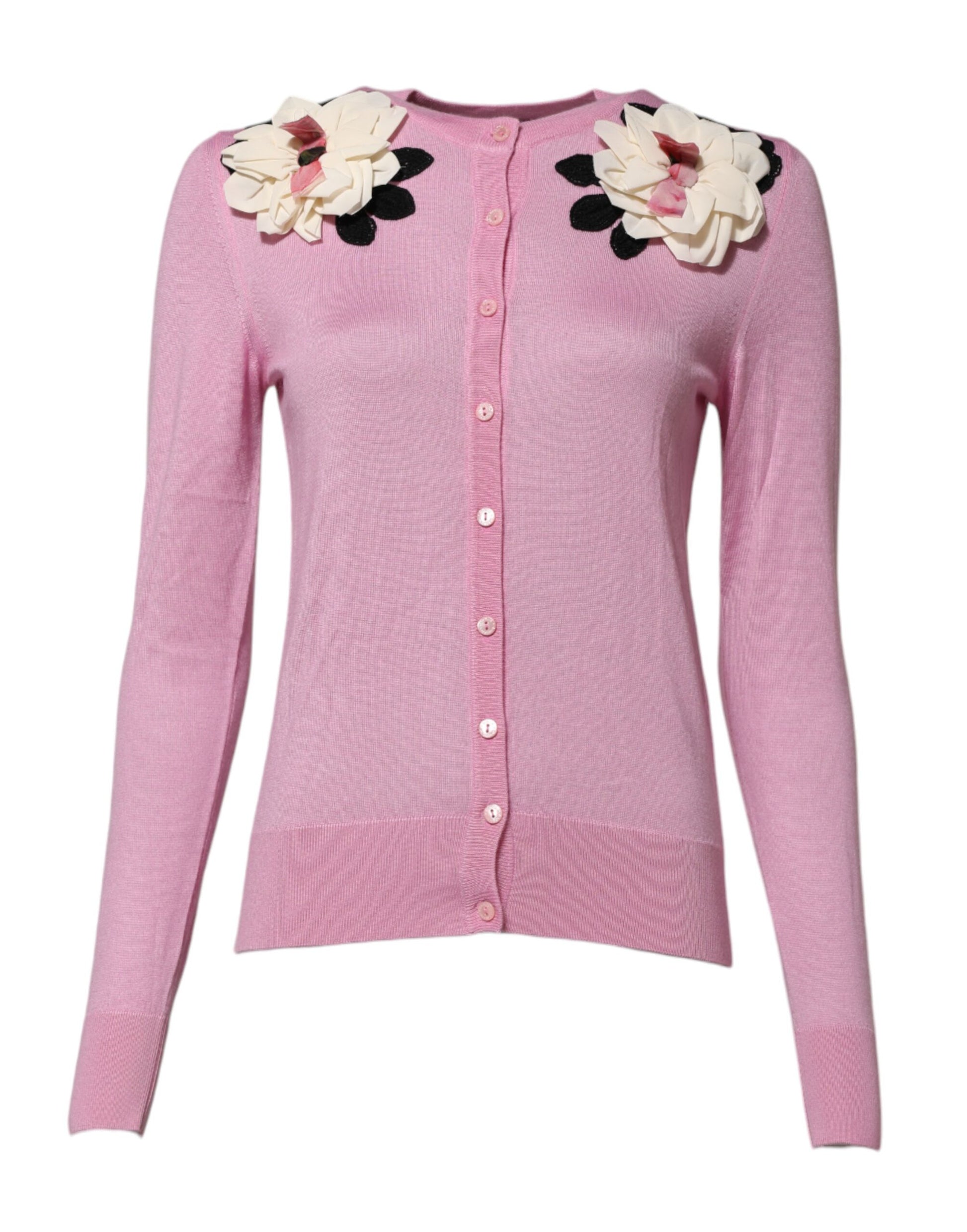 Pink cardigan with floral embellishments on shoulders