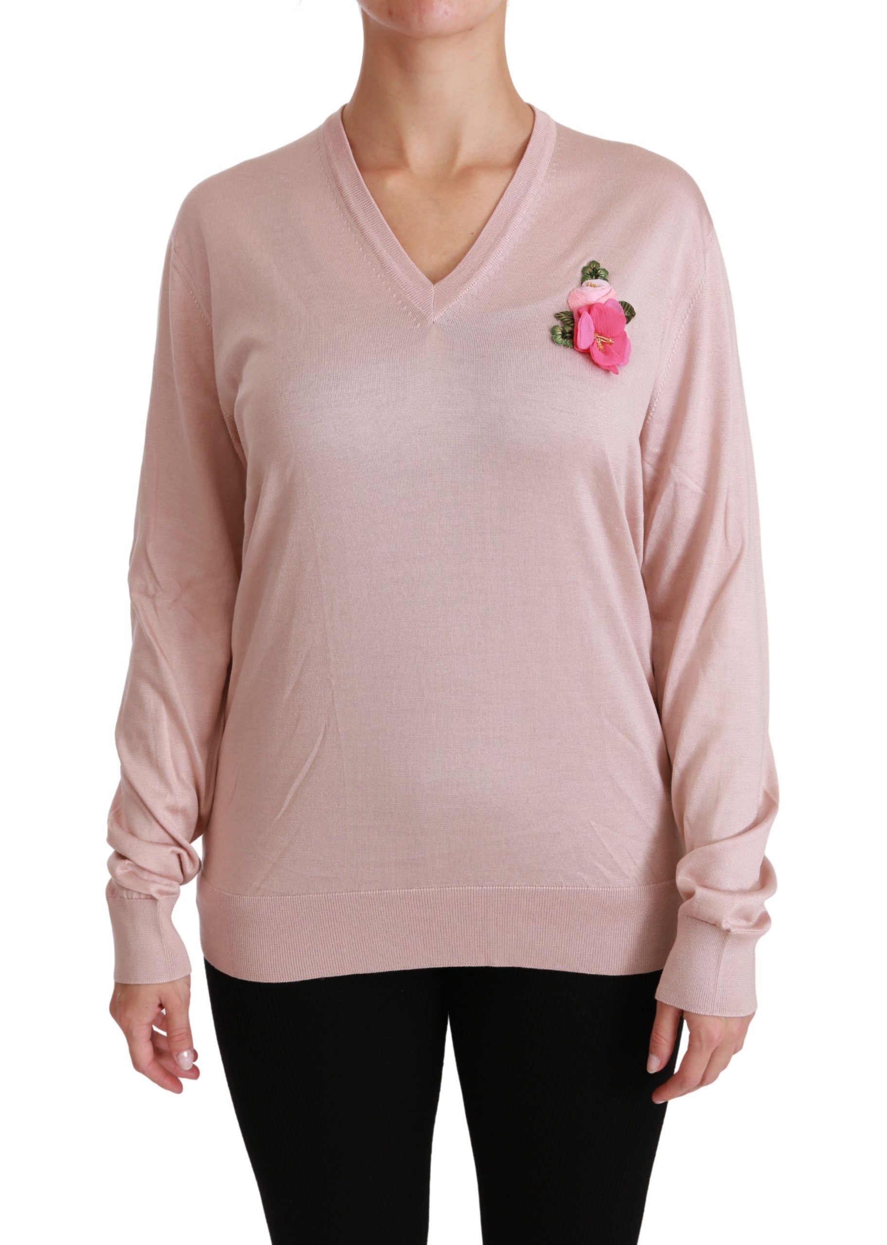 Long sleeve pink sweater with a small pink flower on left side