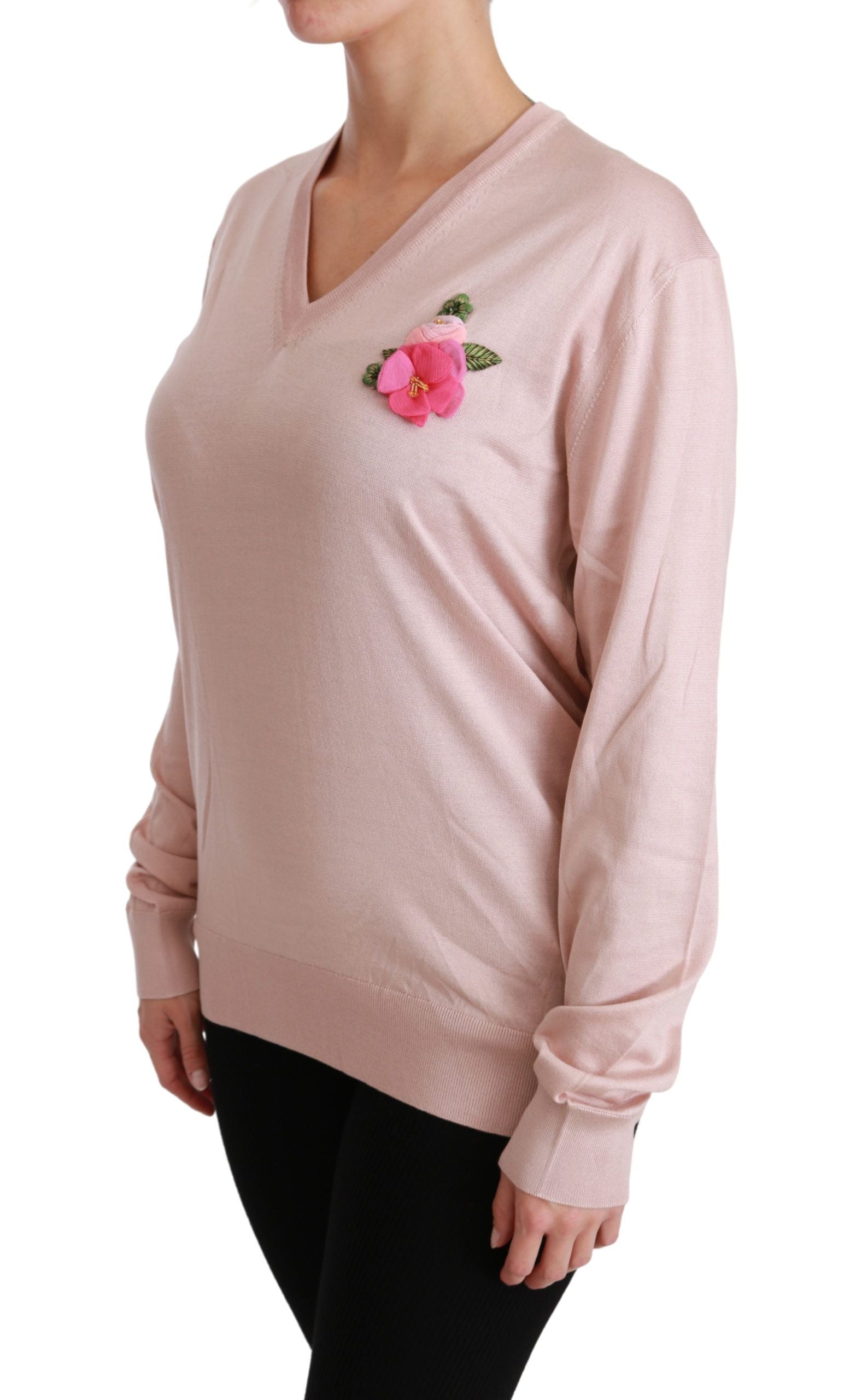 Pink long sleeve sweater with floral embroidery on chest