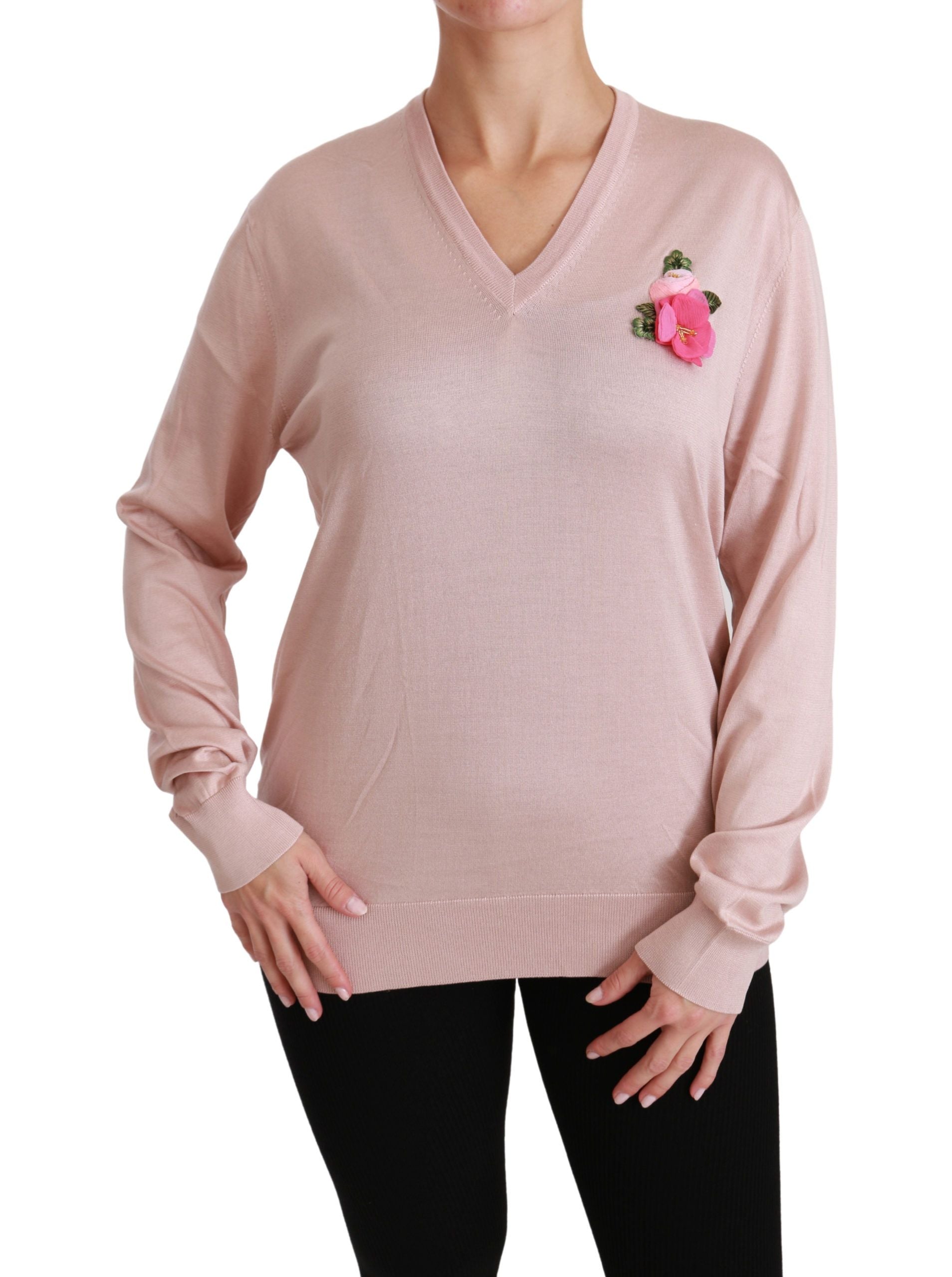 Long sleeve pink sweater with a floral embroidery on the left chest area
