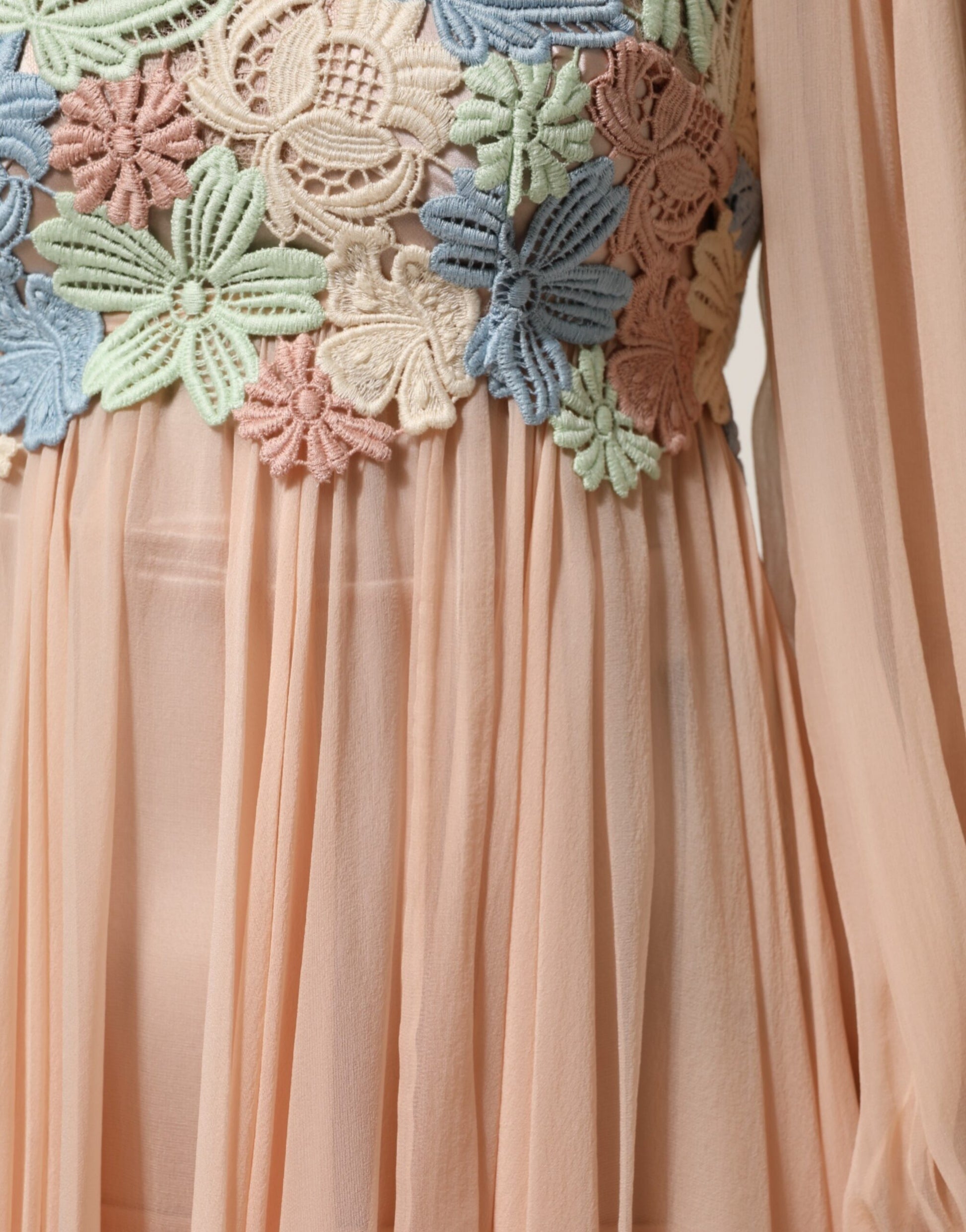 Pink floral embroidered pleated dress with long sleeves and sheer overlay
