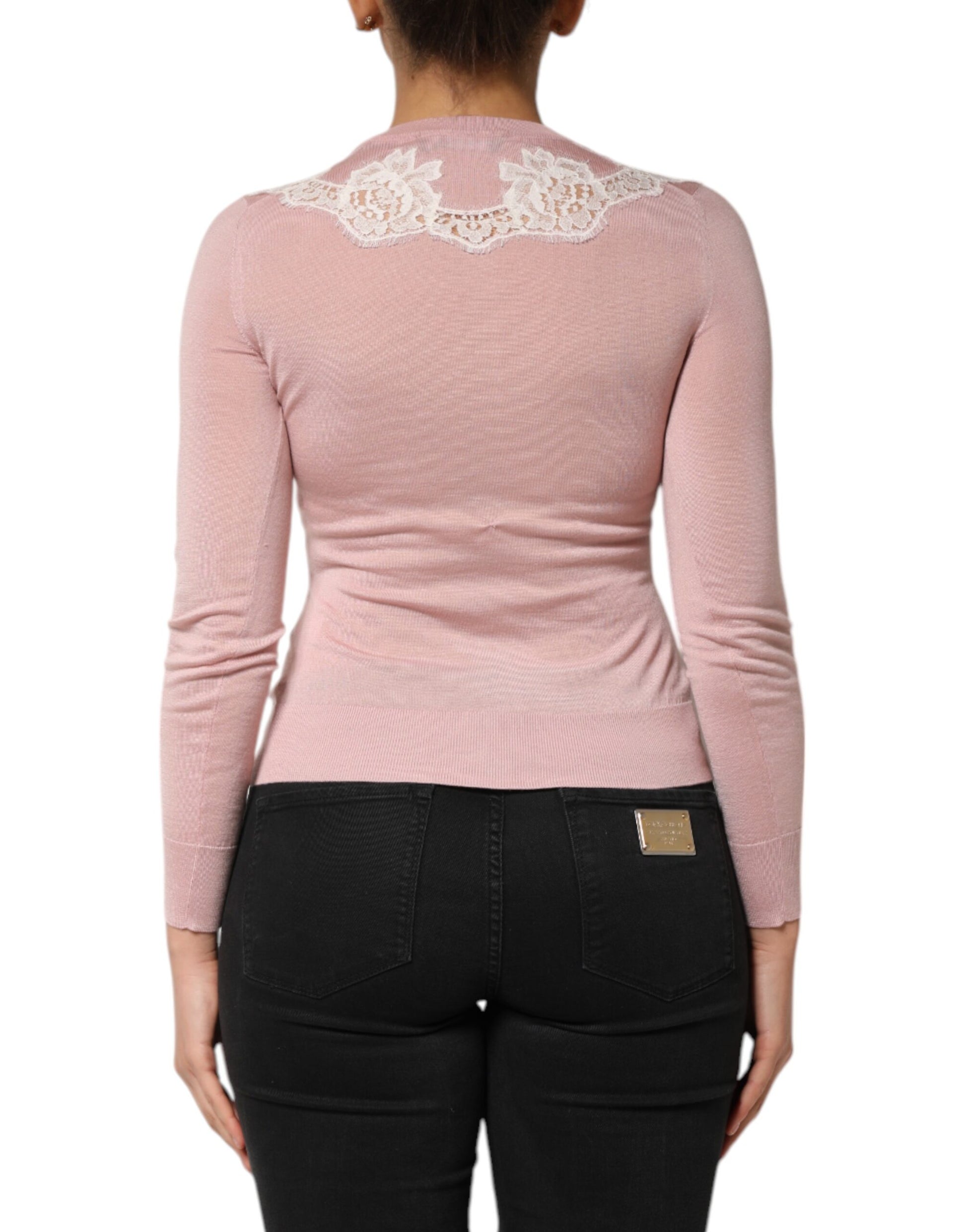 Pink sweater on woman's back