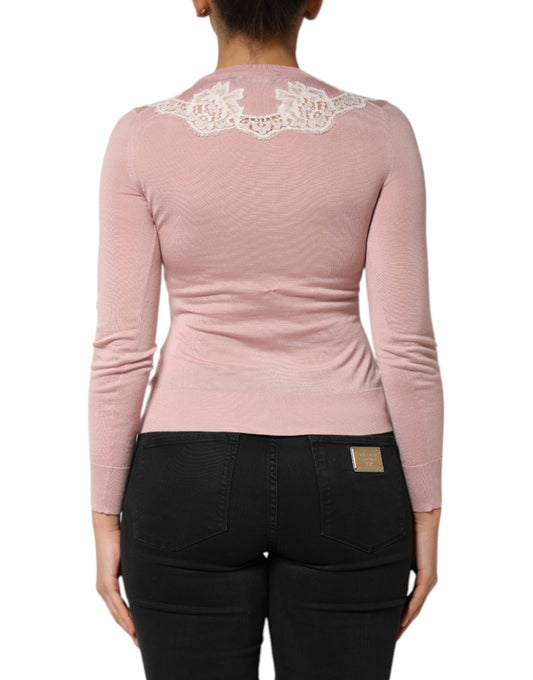 Pink sweater on woman's back