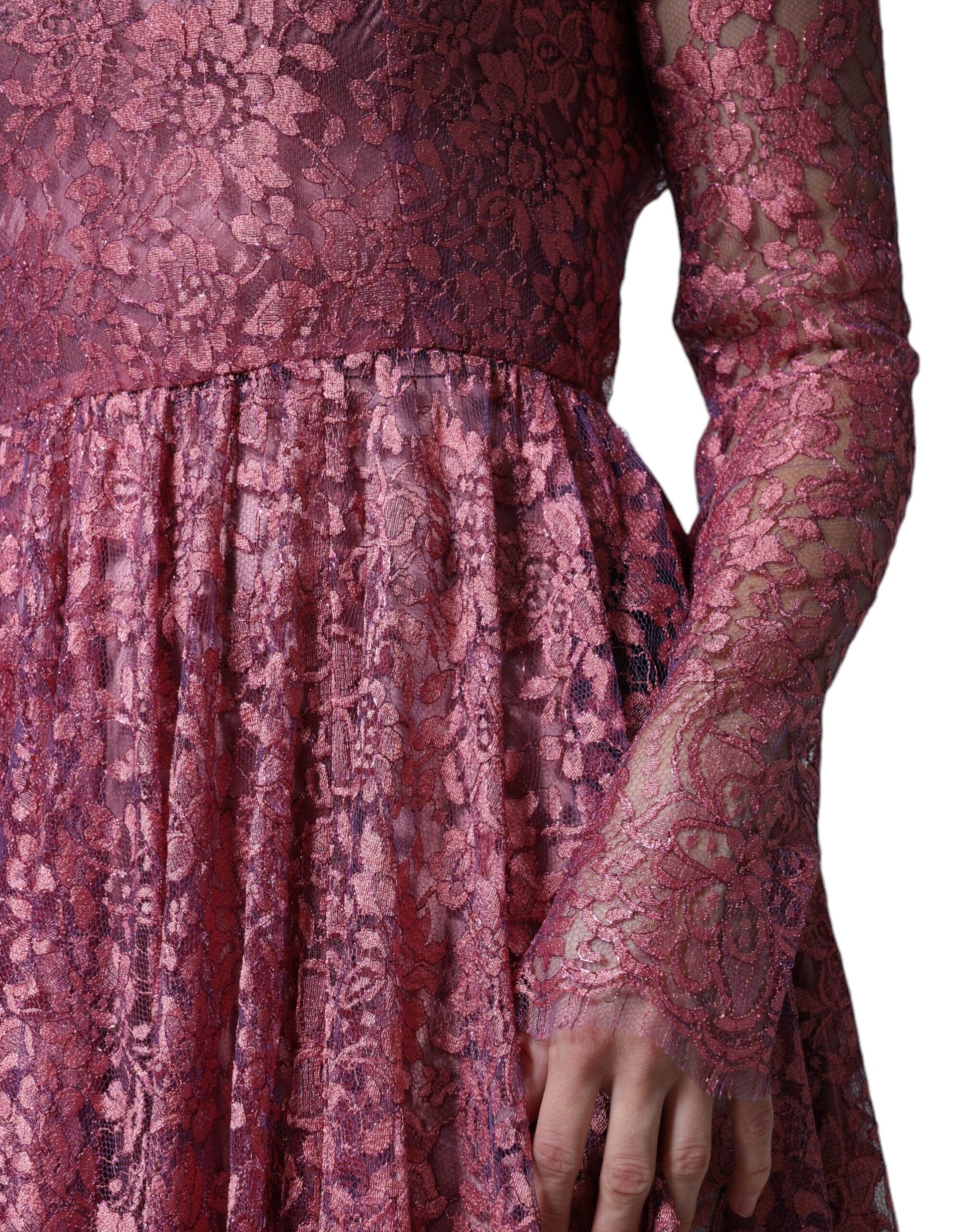 A long sleeved pink floral lace midi dress by Dolce & Gabbana