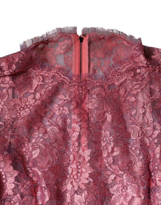A pink floral lace midi dress with long sleeves and a zipper in the front