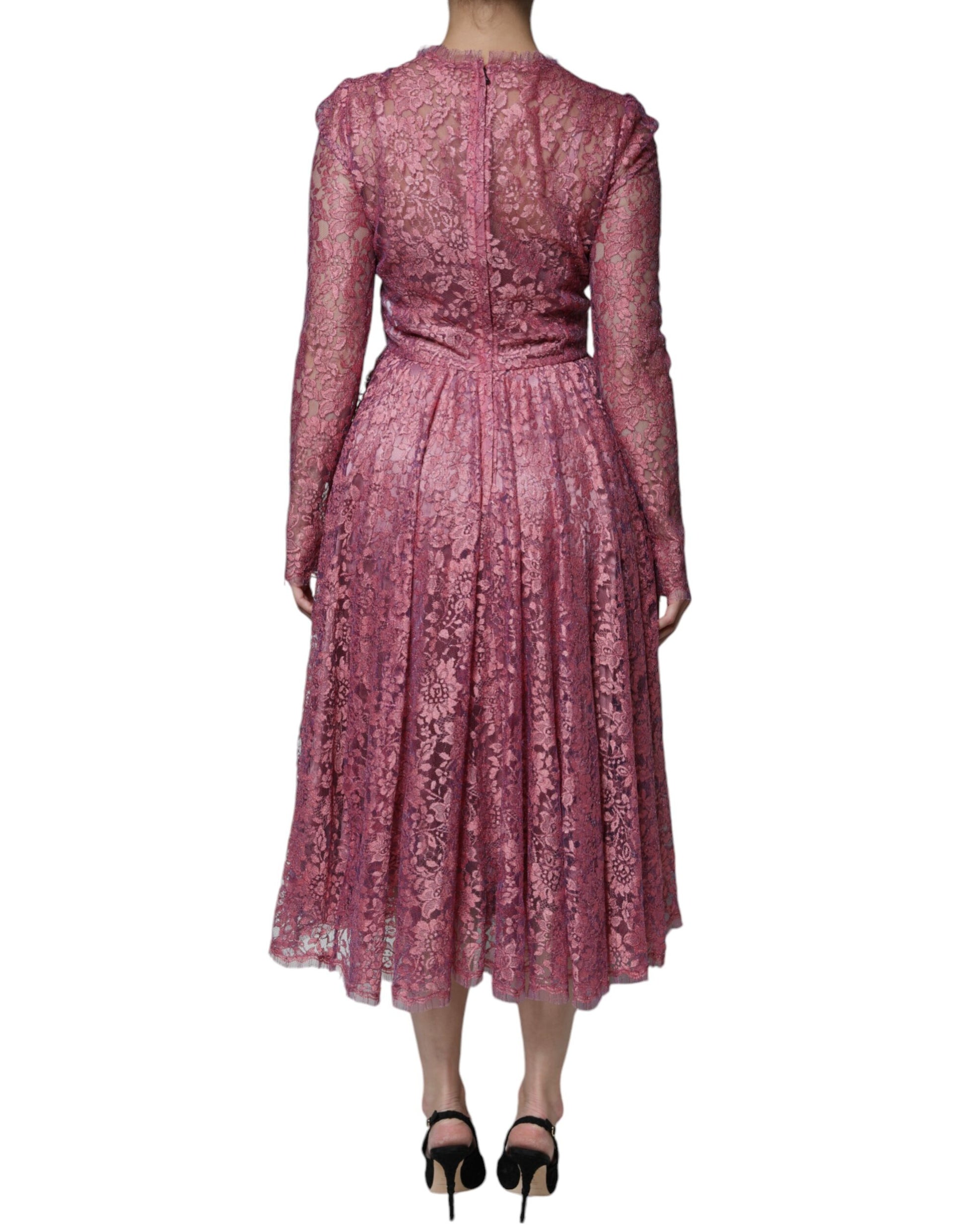 A long sleeved pink floral lace midi dress with a high neckline and back detail