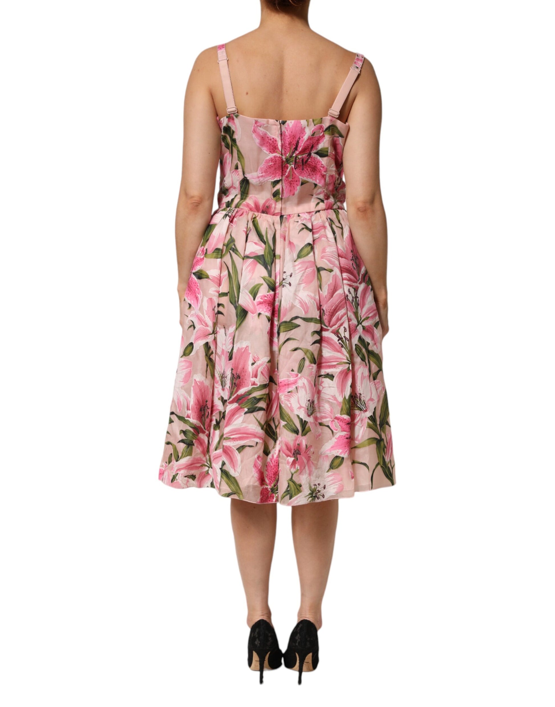 A pink floral print midi dress with sleeveless design