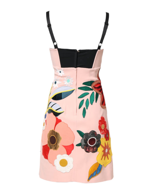 A pink floral print mini dress with spaghetti straps